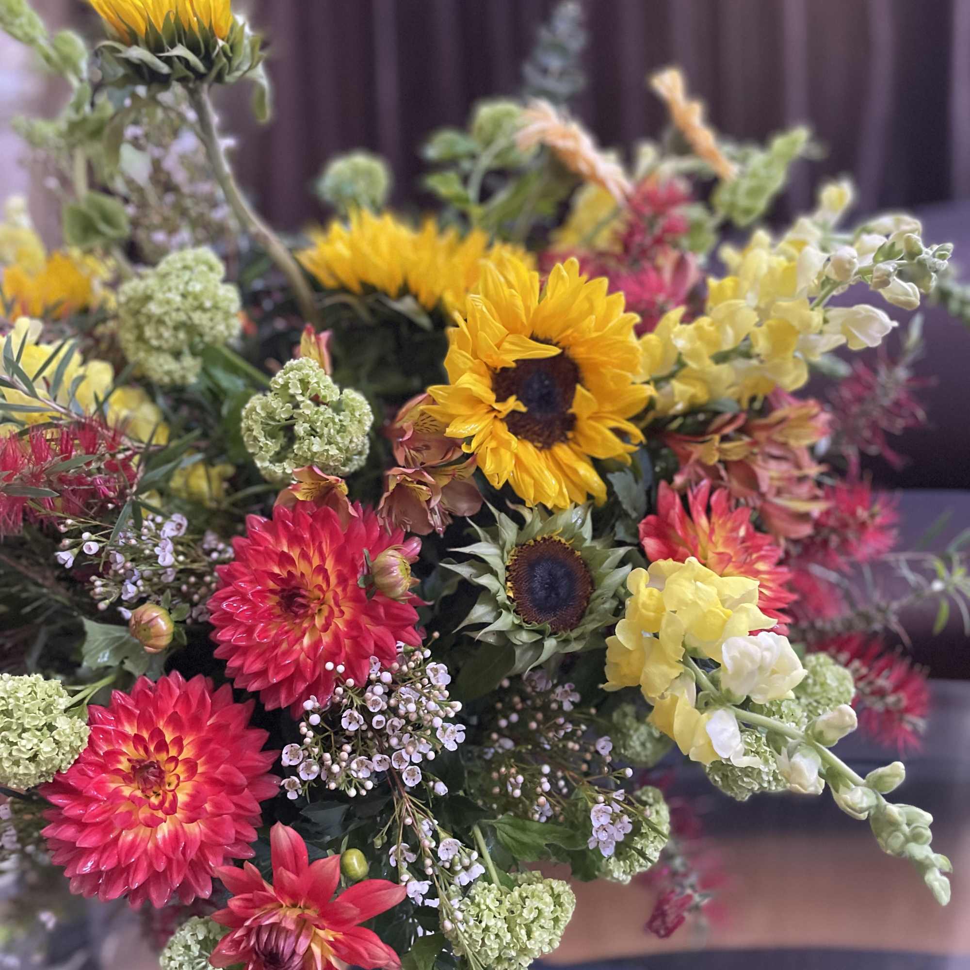 Bright mixed bouquet with sunflowers and pink dahlias