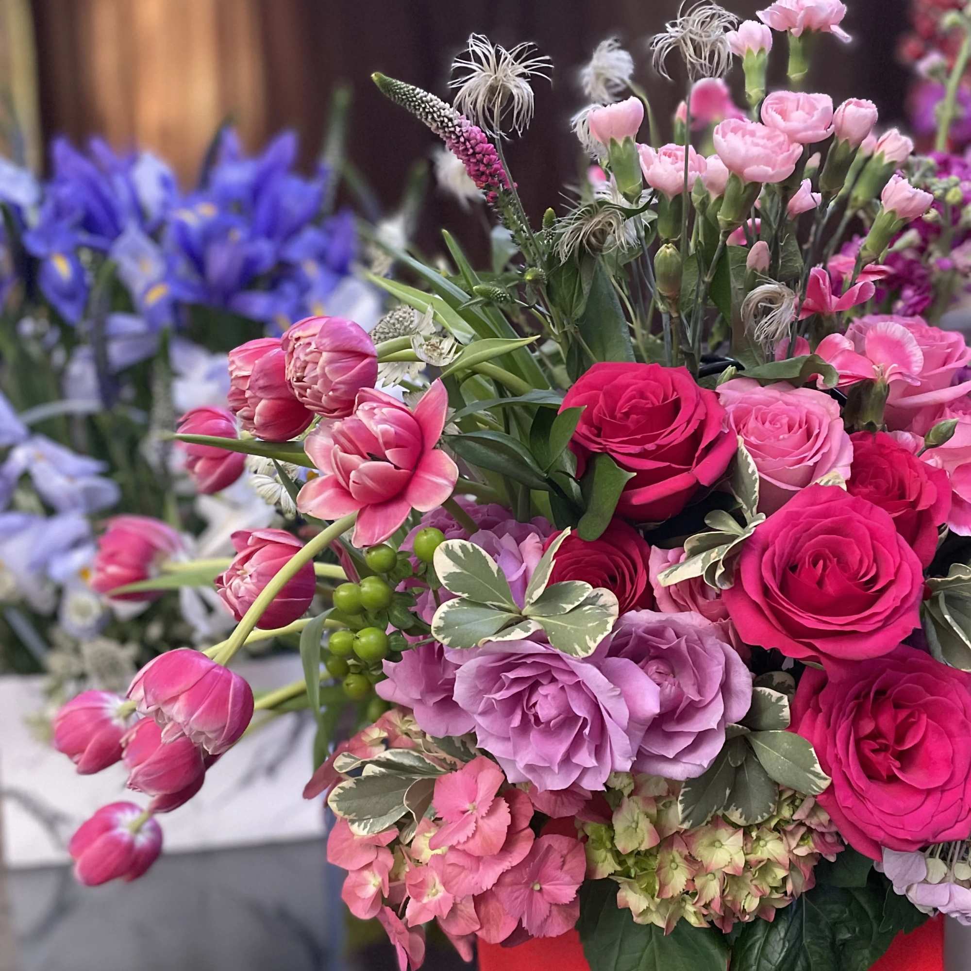 Bright pink and lavender bouquet with roses and tulips