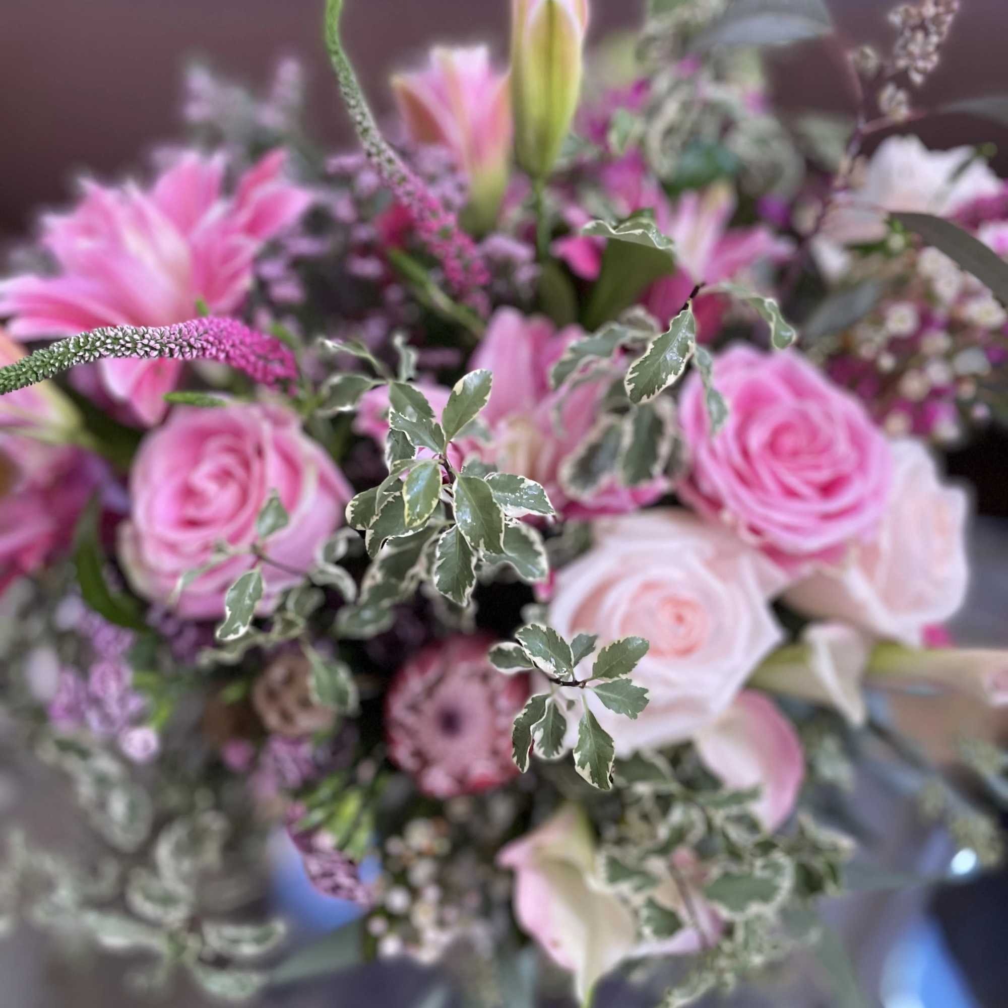Pink roses and lilies in a mixed bouquet