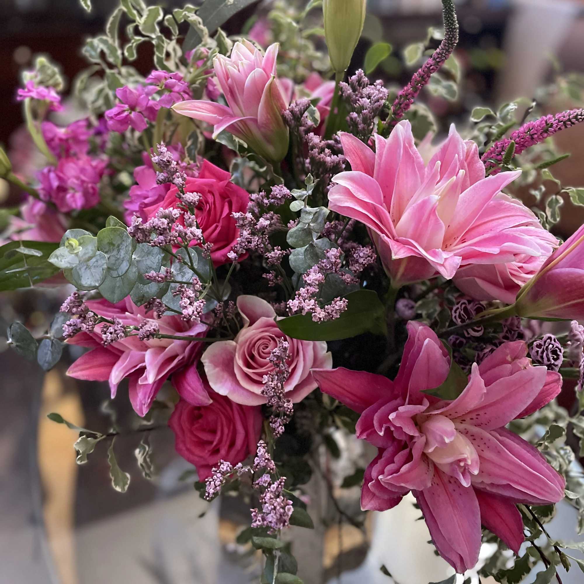 Pink lilies and roses in a mixed bouquet