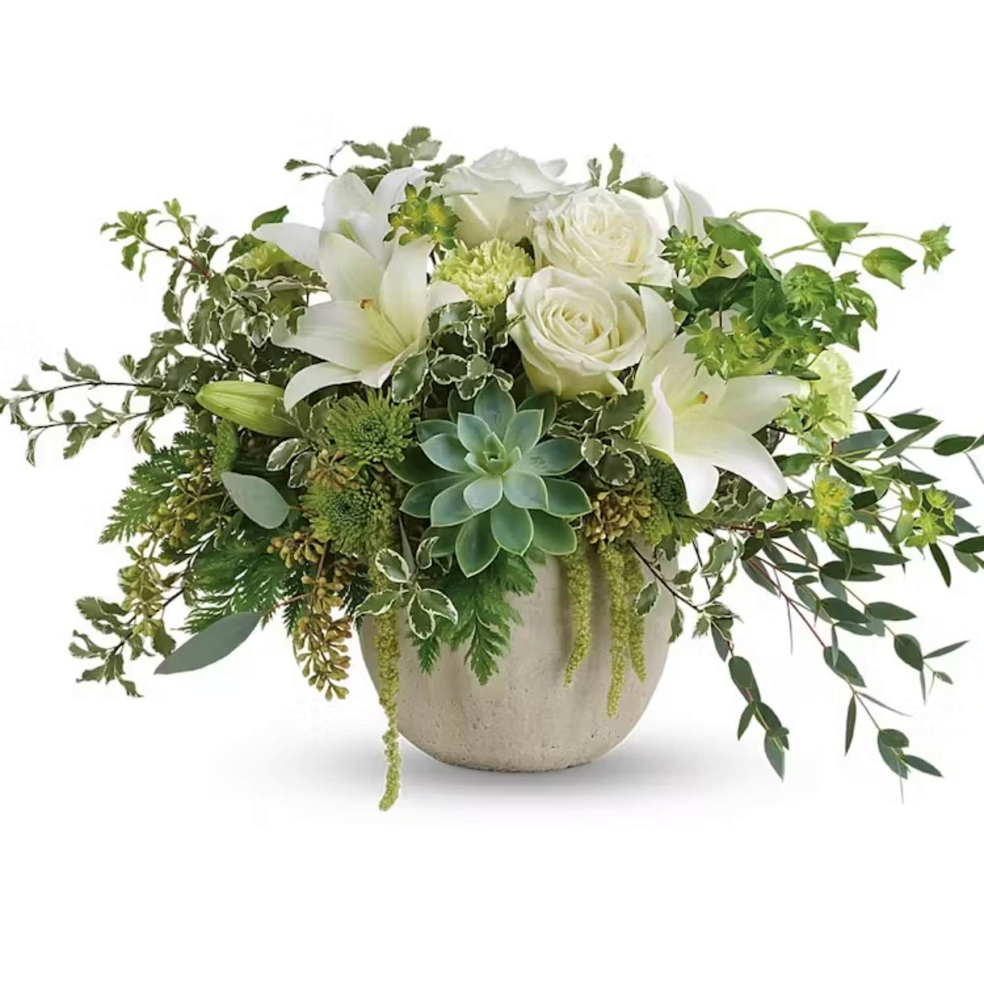 White lilies and roses in a round vase with trailing greenery