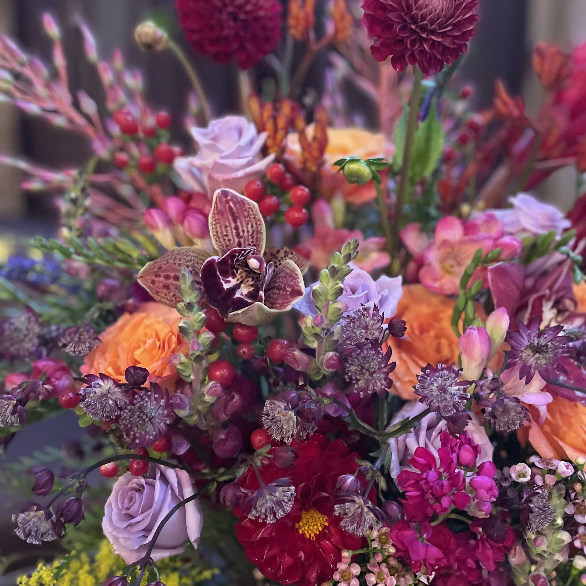 Mixed bouquet with magenta, orange, and lavender flowers
