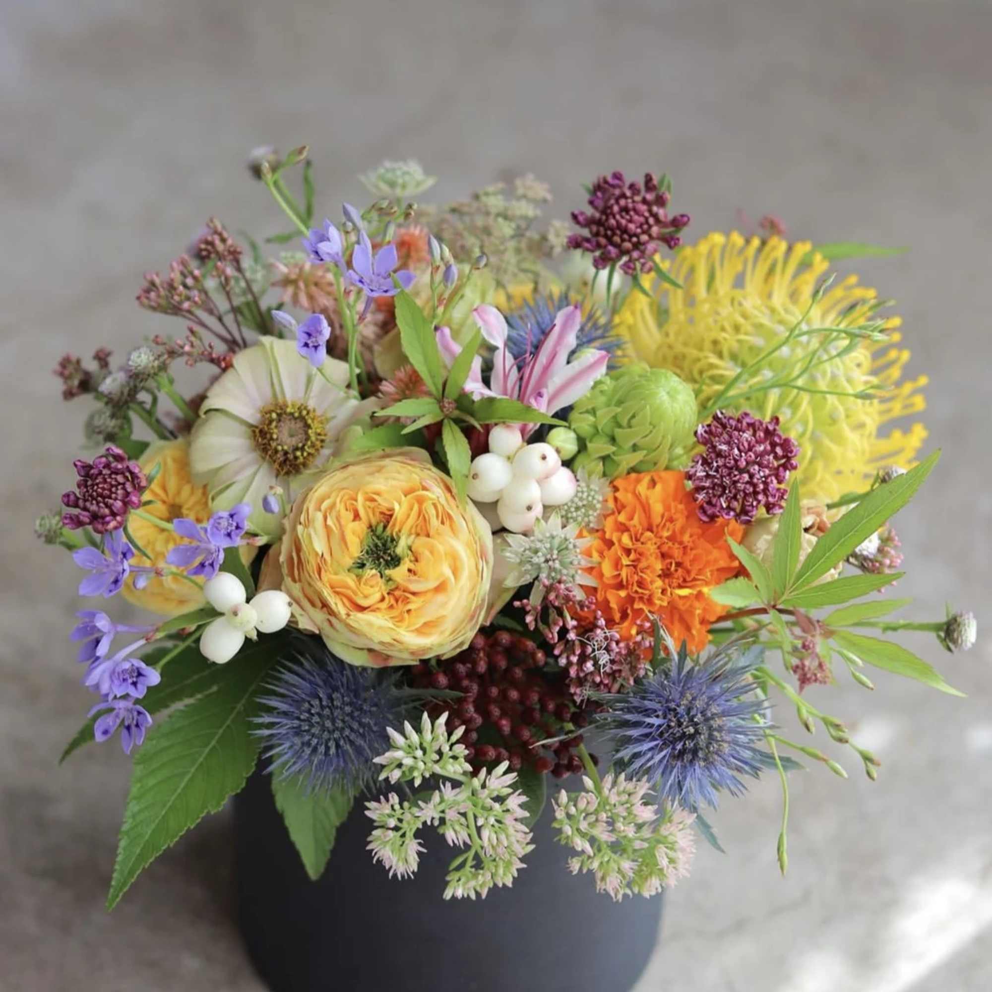 Elevate your cocktail celebration with our exquisite "Seasonal Splendor" floral arrangements, where, photo 2 of 5
