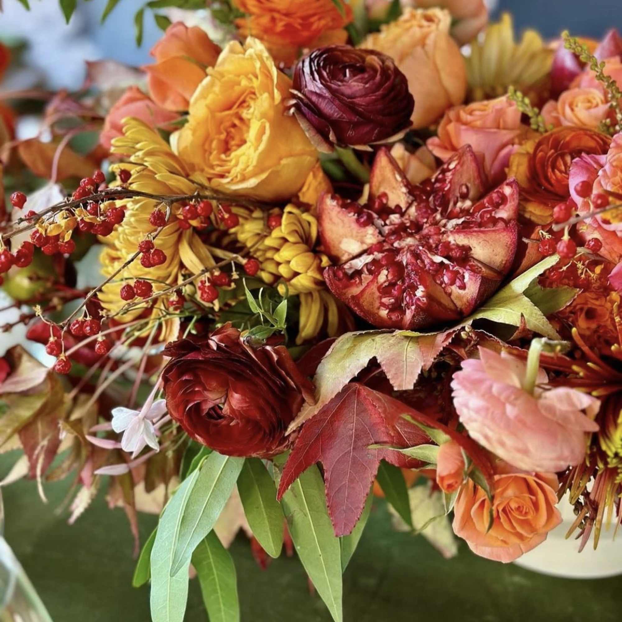 Autumn bouquet with orange, red, and yellow flowers