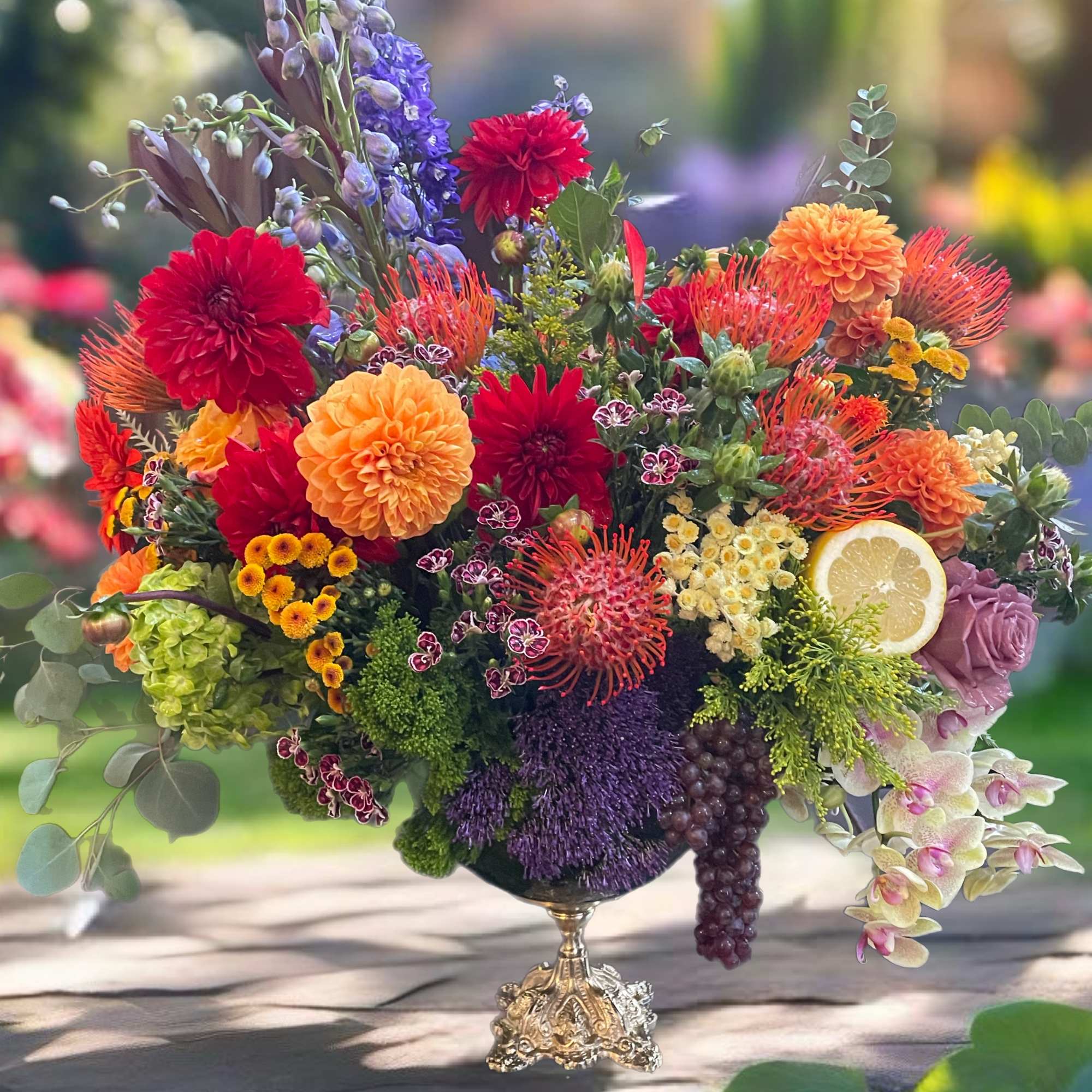 Colorful mixed bouquet in a decorative pedestal vase