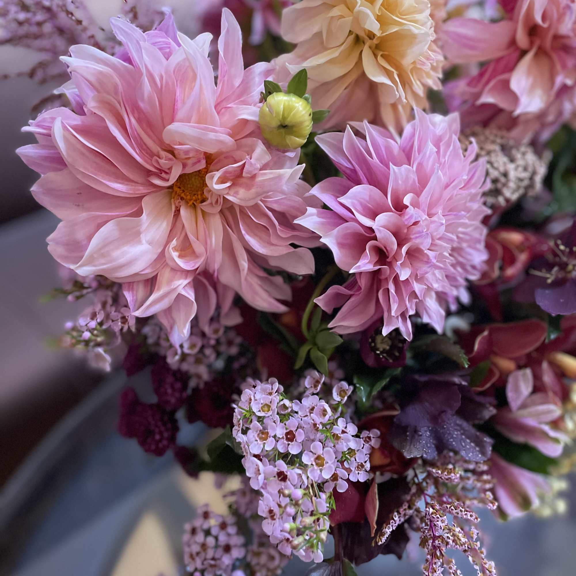 Pink and peach dahlia bouquet with small filler flowers