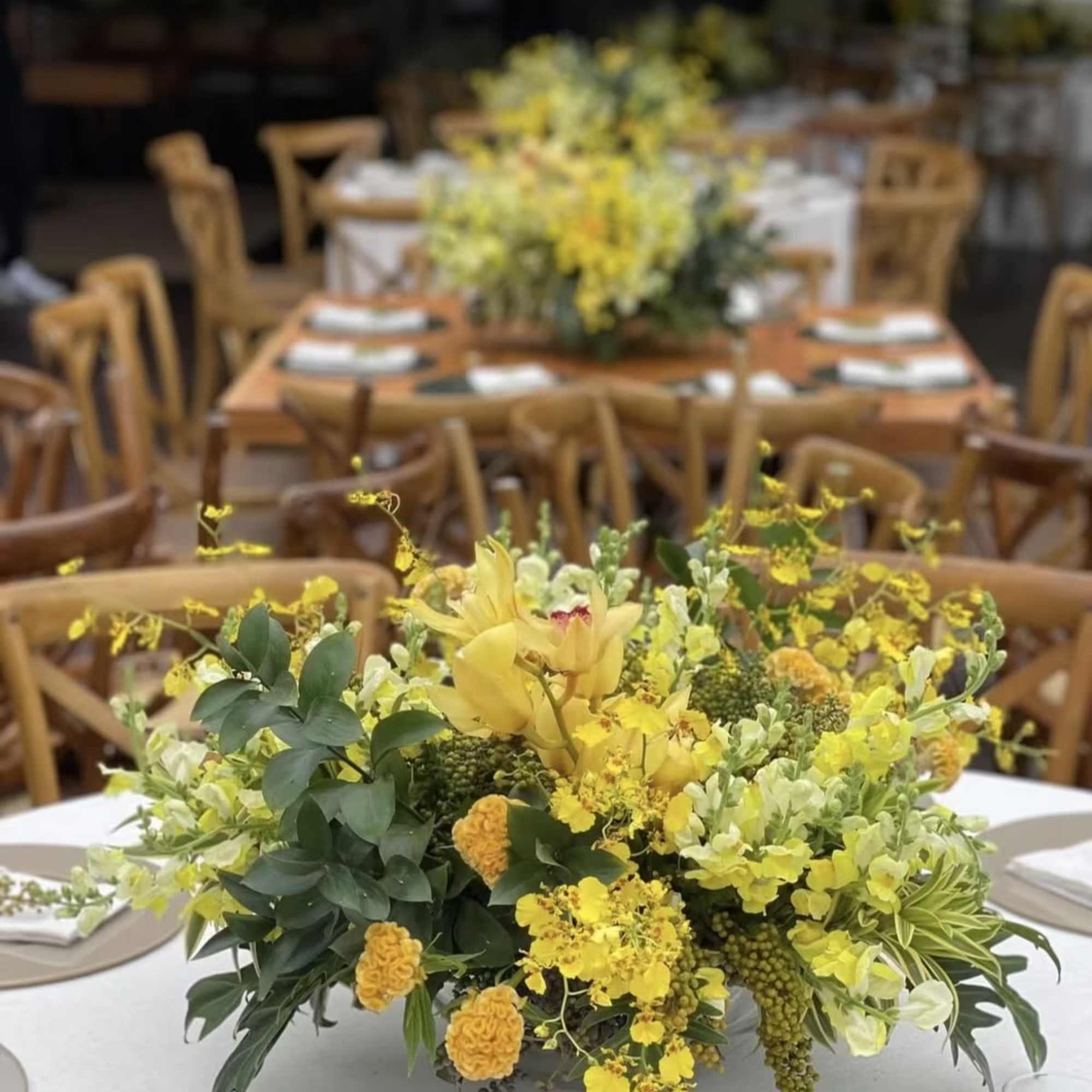 Yellow floral centerpiece on a round table