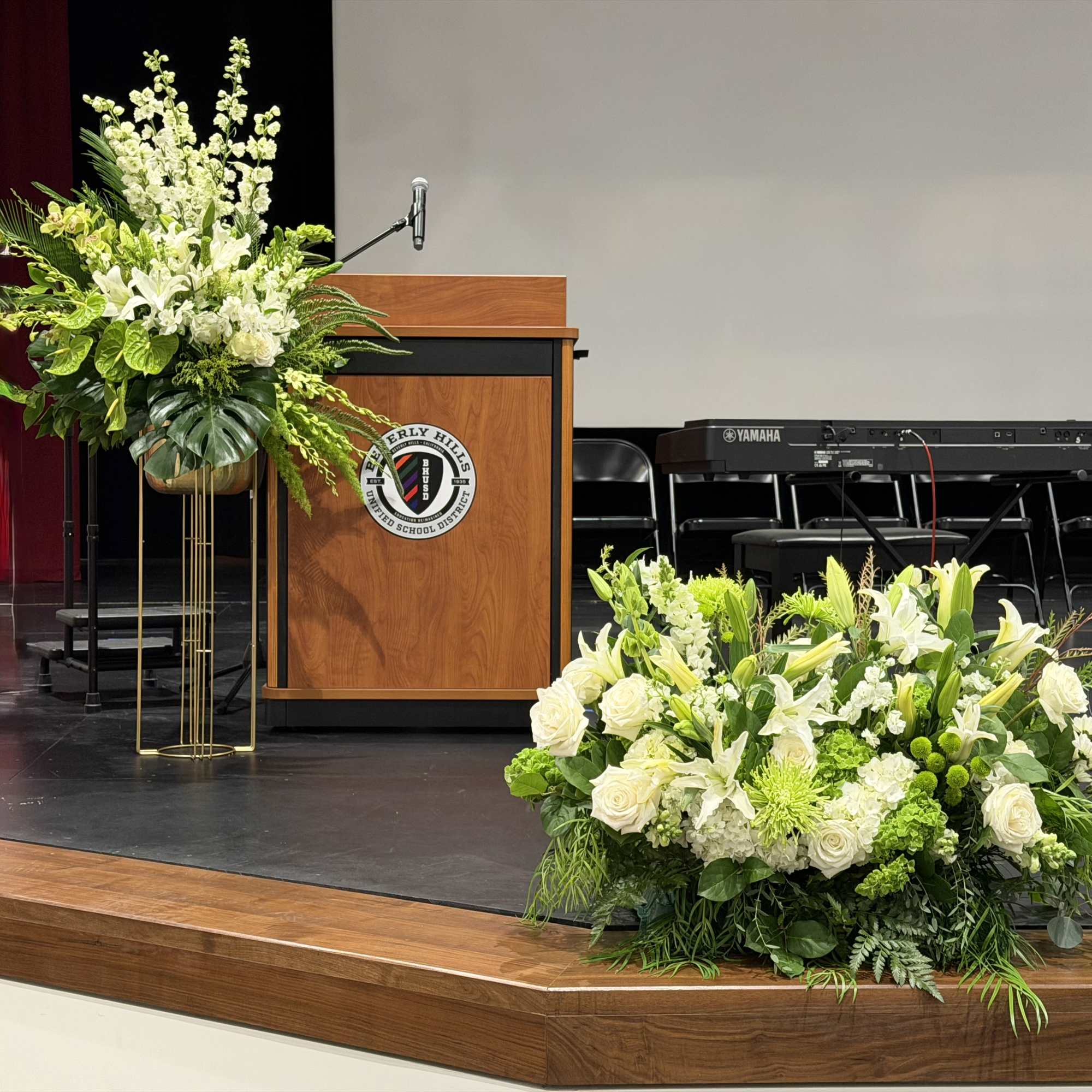 A towering, ceremonial display built to command a stage-this podium stage arrangement