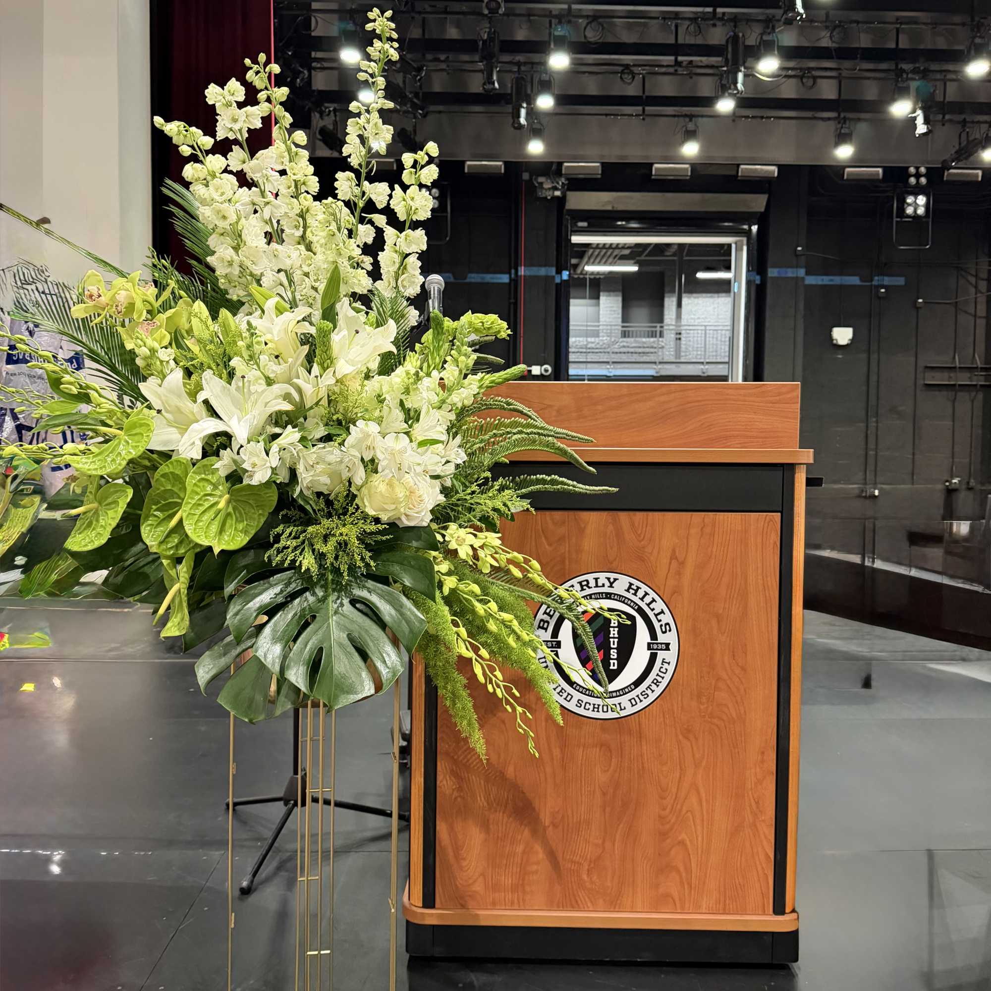 A towering, ceremonial display built to command a stage-this podium stage arrangement