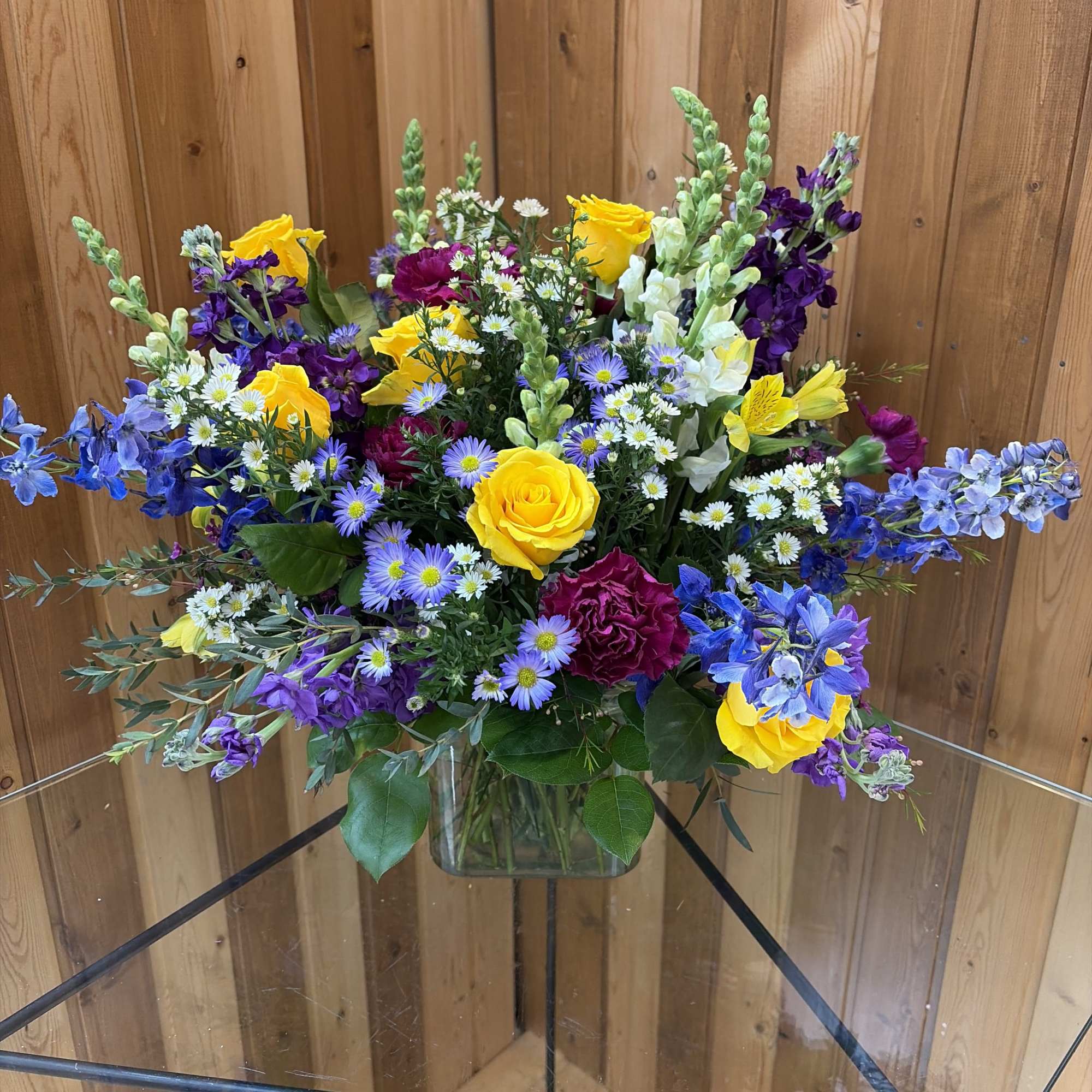 Colorful mixed bouquet in a clear glass vase