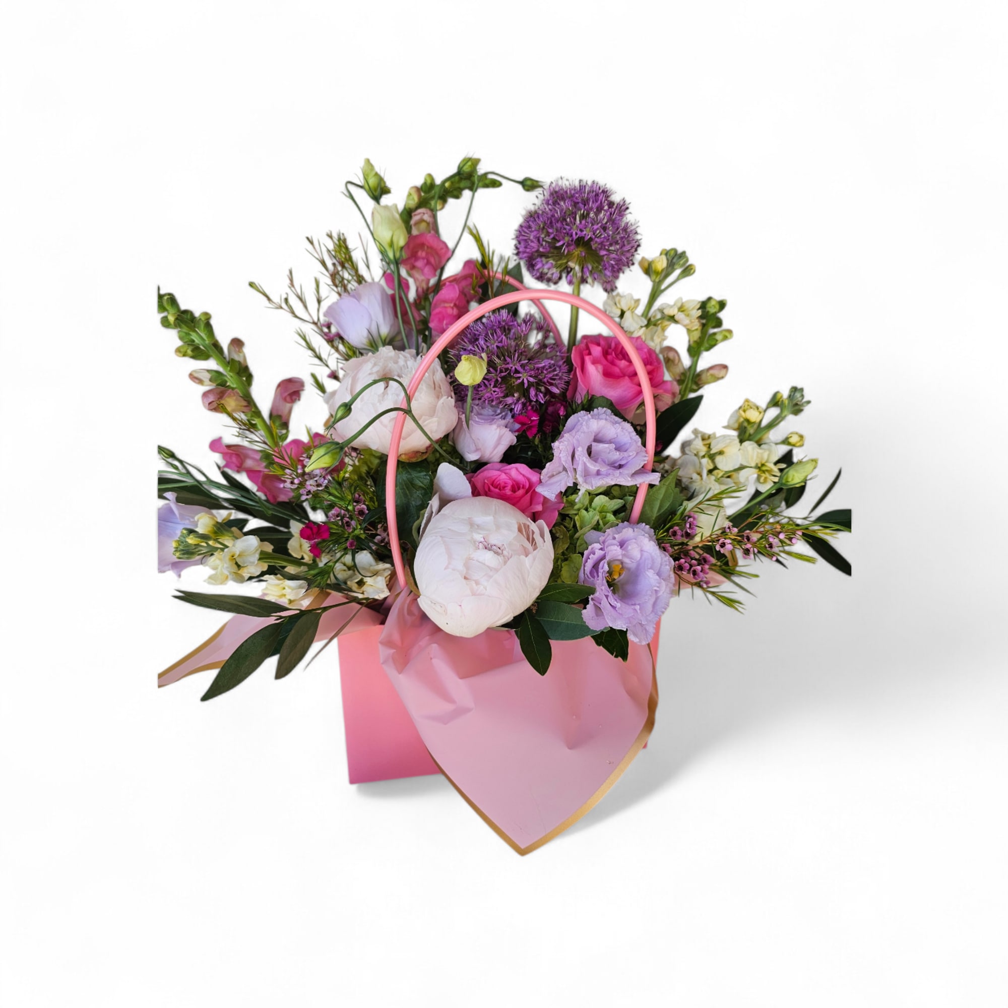 Our Blooming Purses are thoughtfully designed arrangements, blending soft, feminine colors with