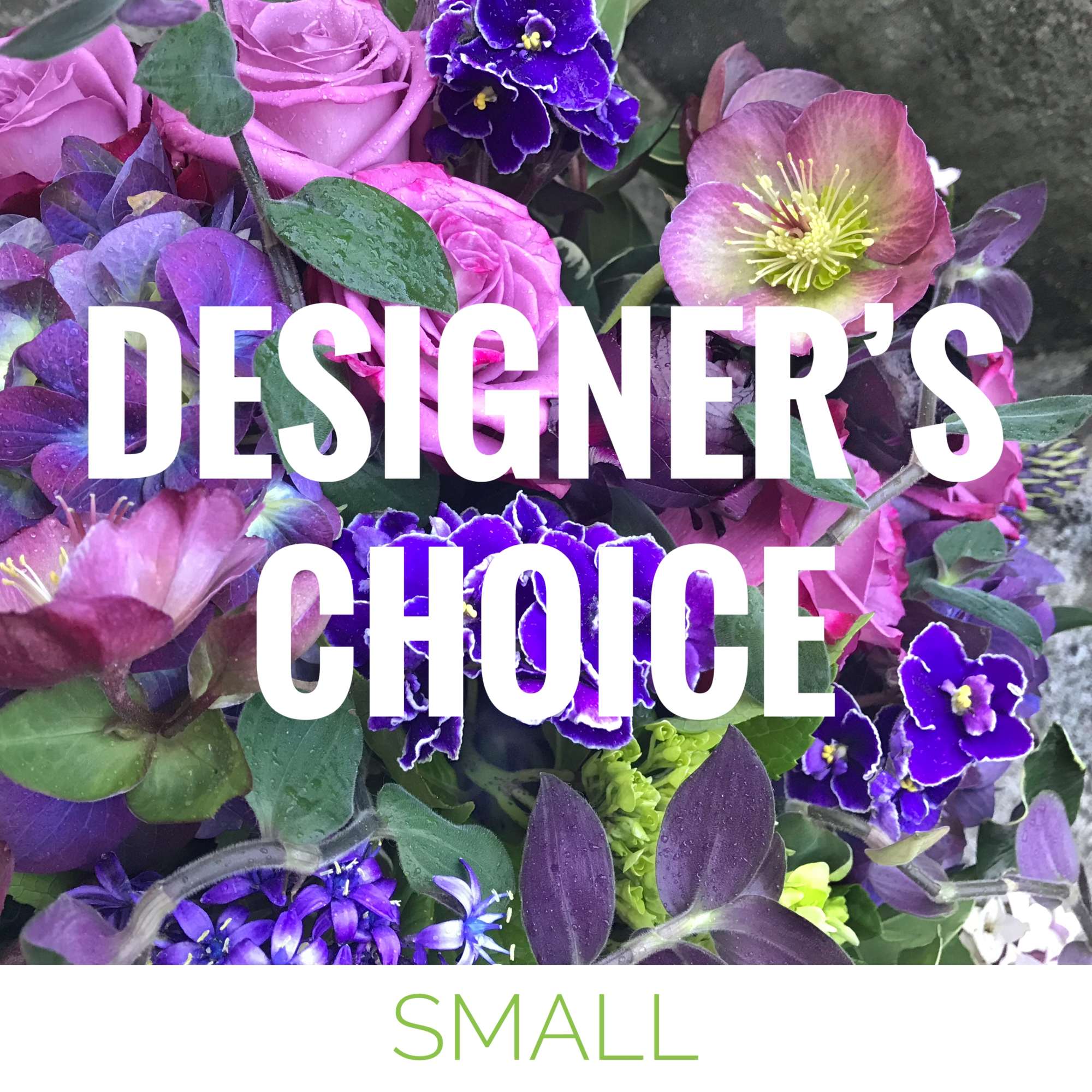 Purple floral arrangement with roses and hellebore blooms