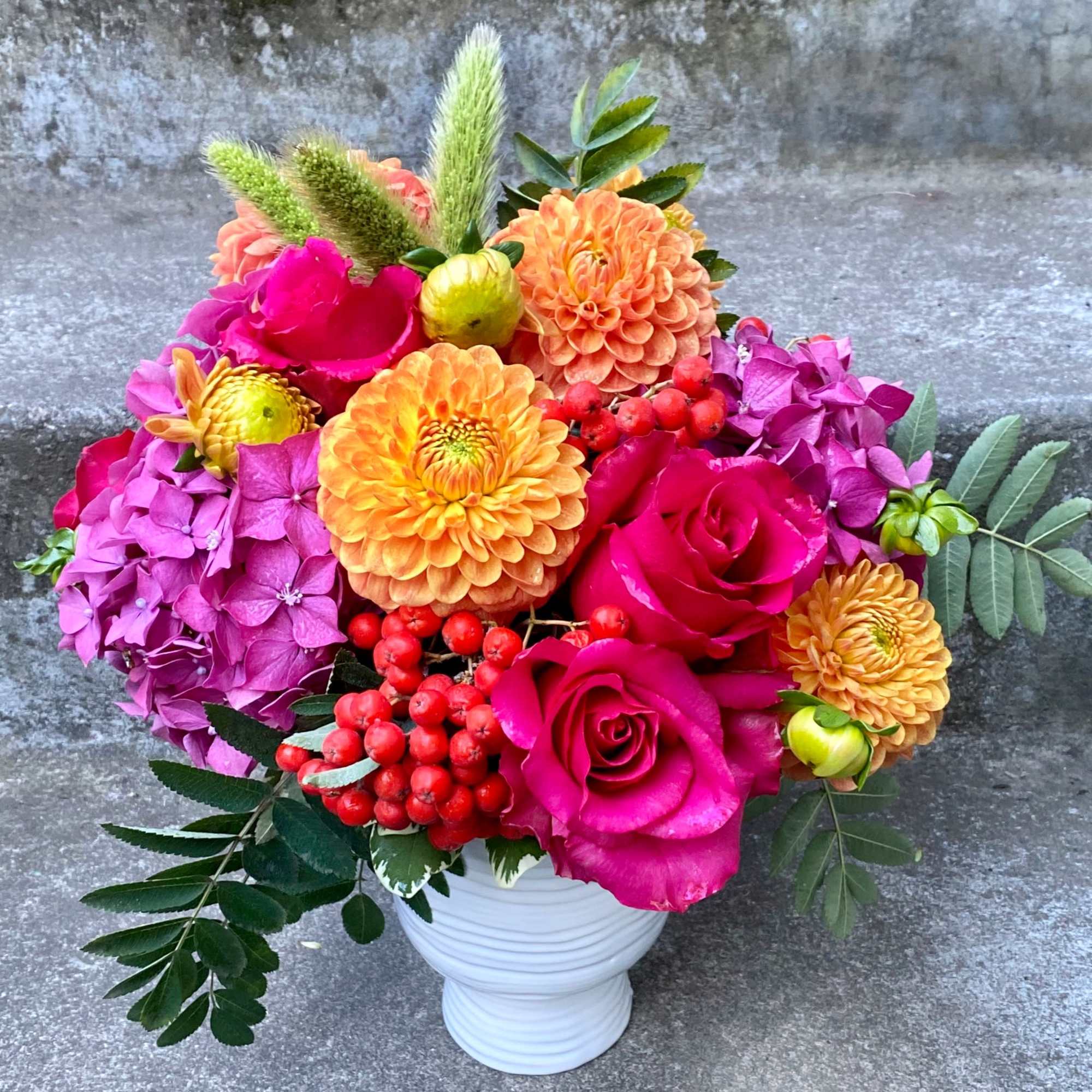 A Designer's Choice mixed floral arrangement featuring summer flowers such as dahlias, photo 7 of 9