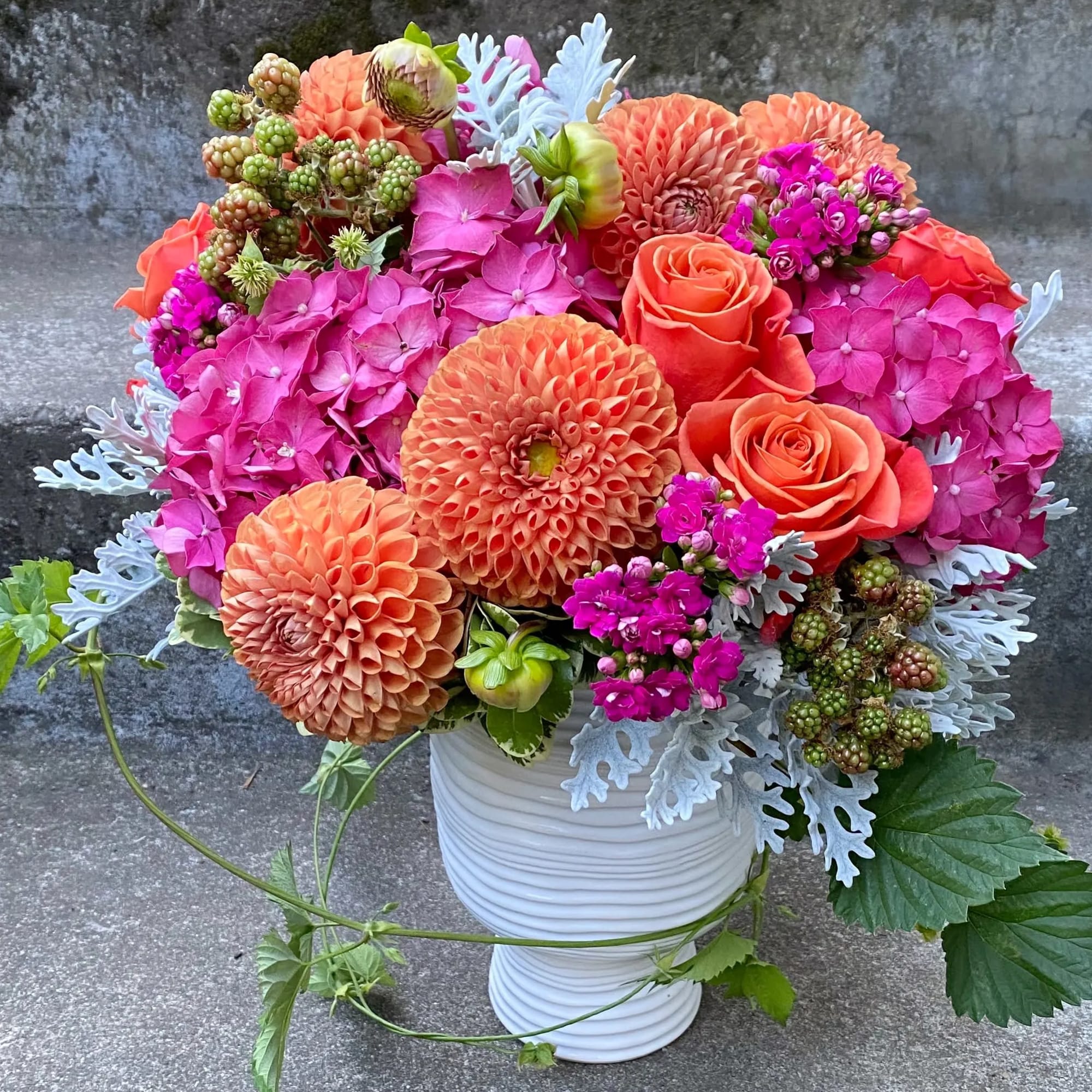 A Designer's Choice mixed floral arrangement featuring summer flowers such as dahlias, photo 5 of 7