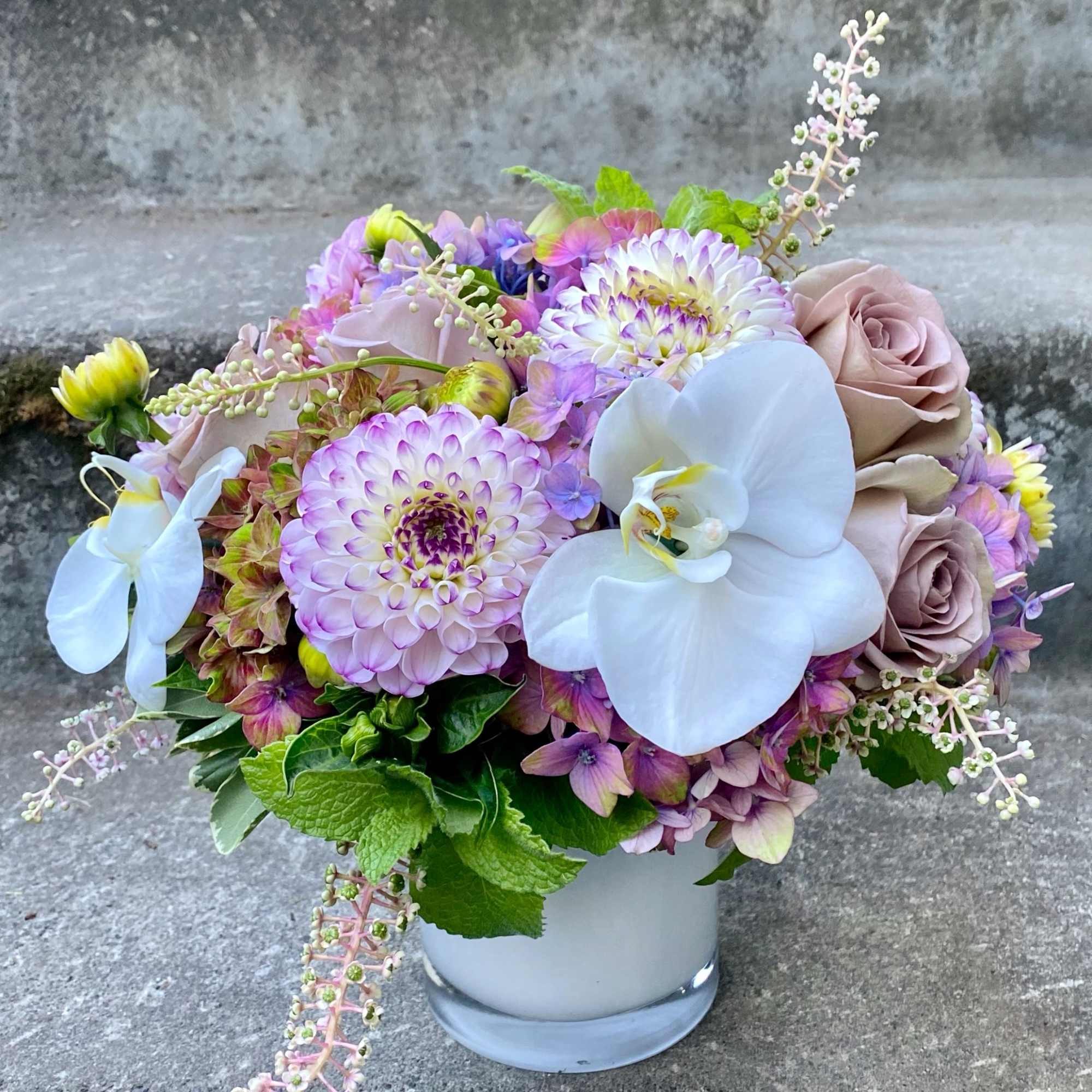 A compact arrangement perfectly scaled for a small desk, nightstand or side