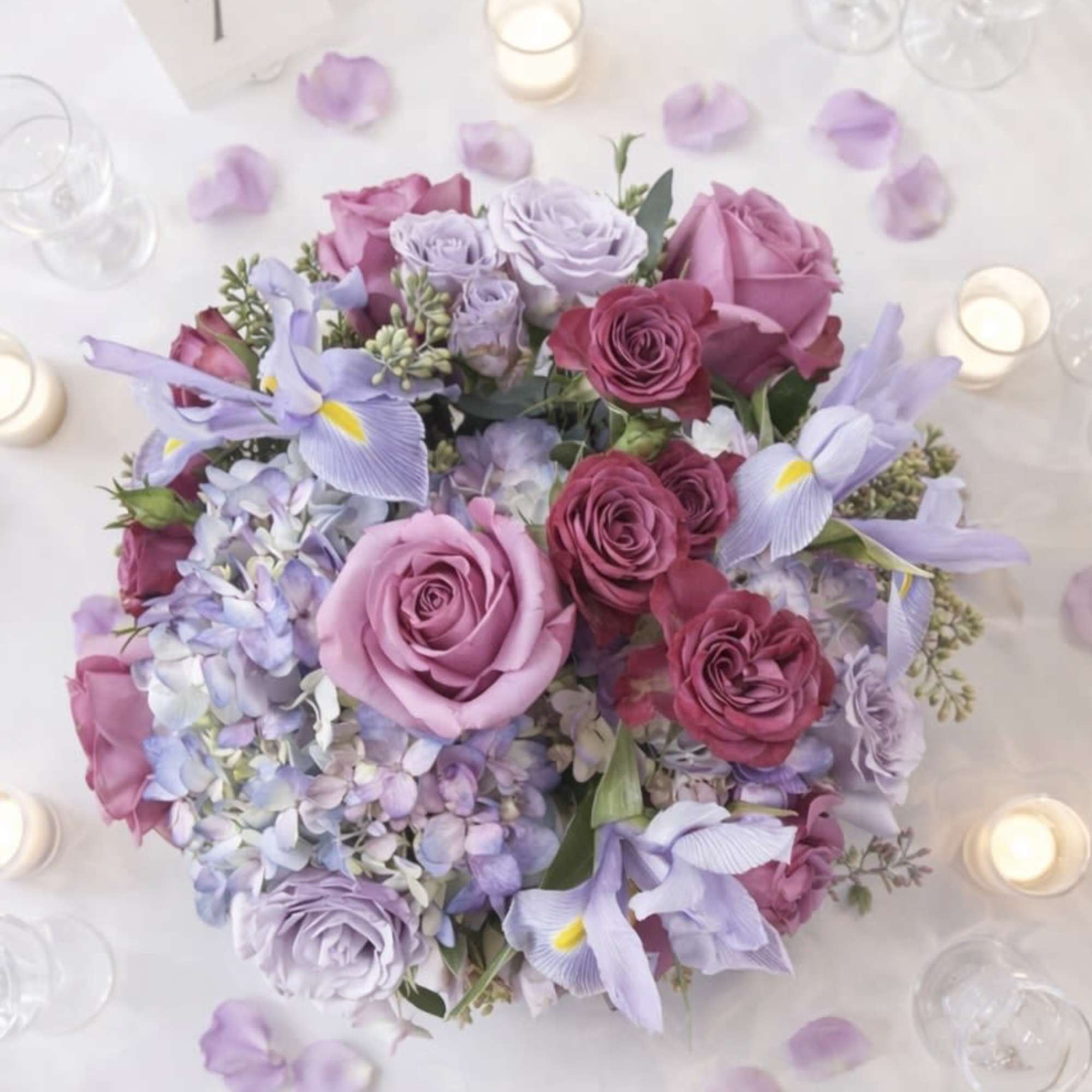 Lavender Skies Wedding Centerpiece features lavender roses, lavender spray roses, hydrangeas, iris, photo 2 of 2