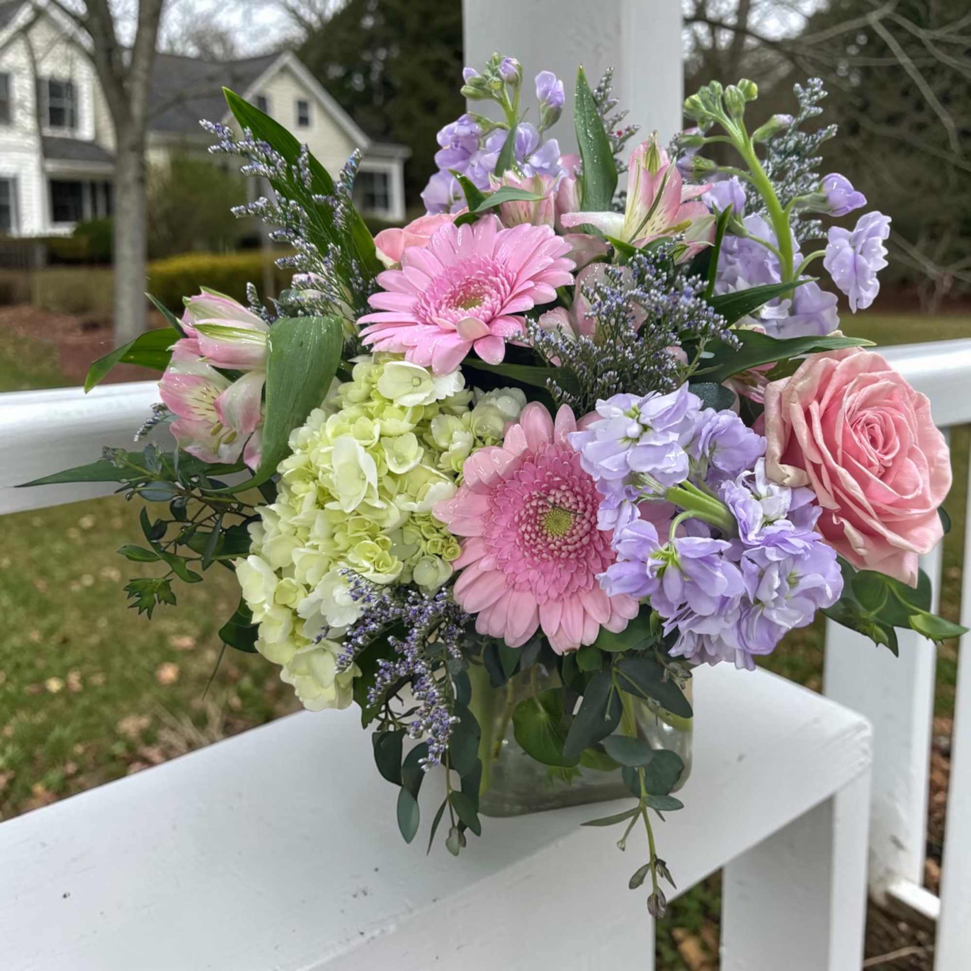 Spring Sorbet Cube is a soft pastel arrangement of pink roses, mini