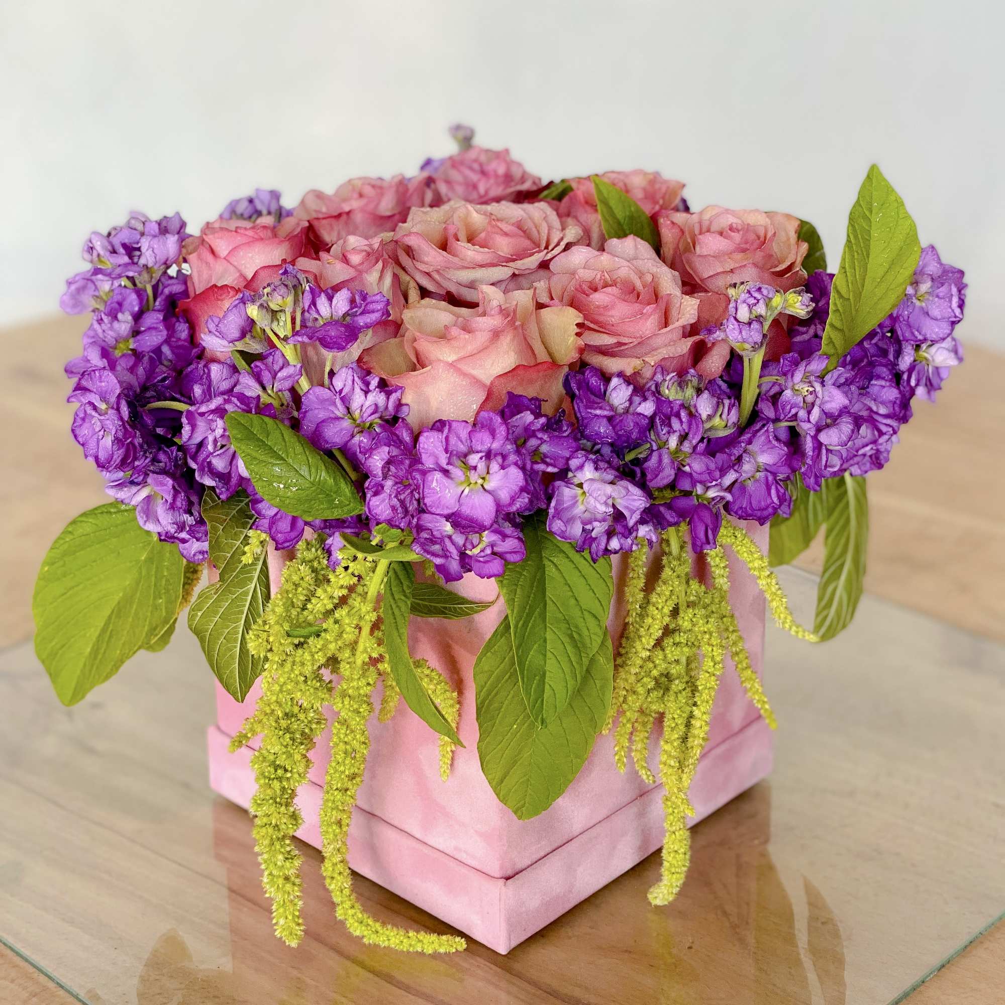 Pink roses and purple flowers arranged in a pink box, photo 3 of 3