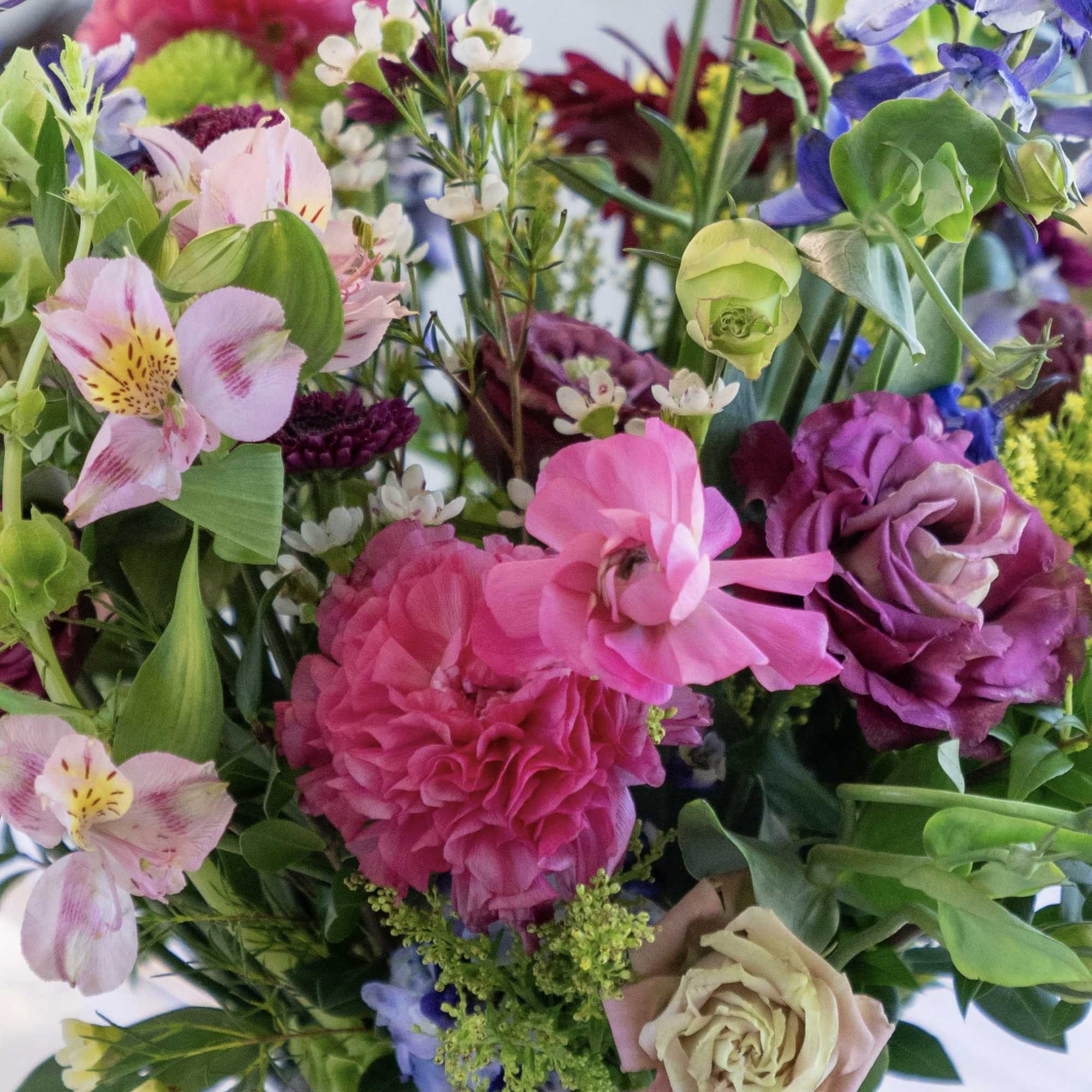 Mixed bouquet with pink, purple, and cream flowers
