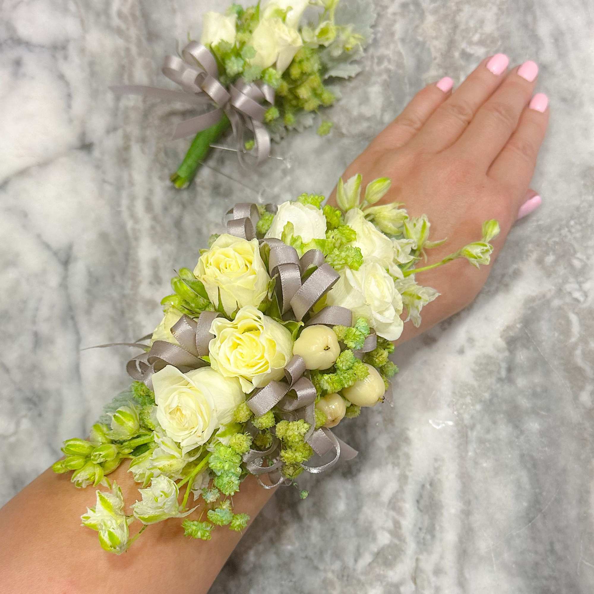 Corsage and Boutonni&egrave;re set with spray roses, alstroemeria and baby&rsquo;s breath accented