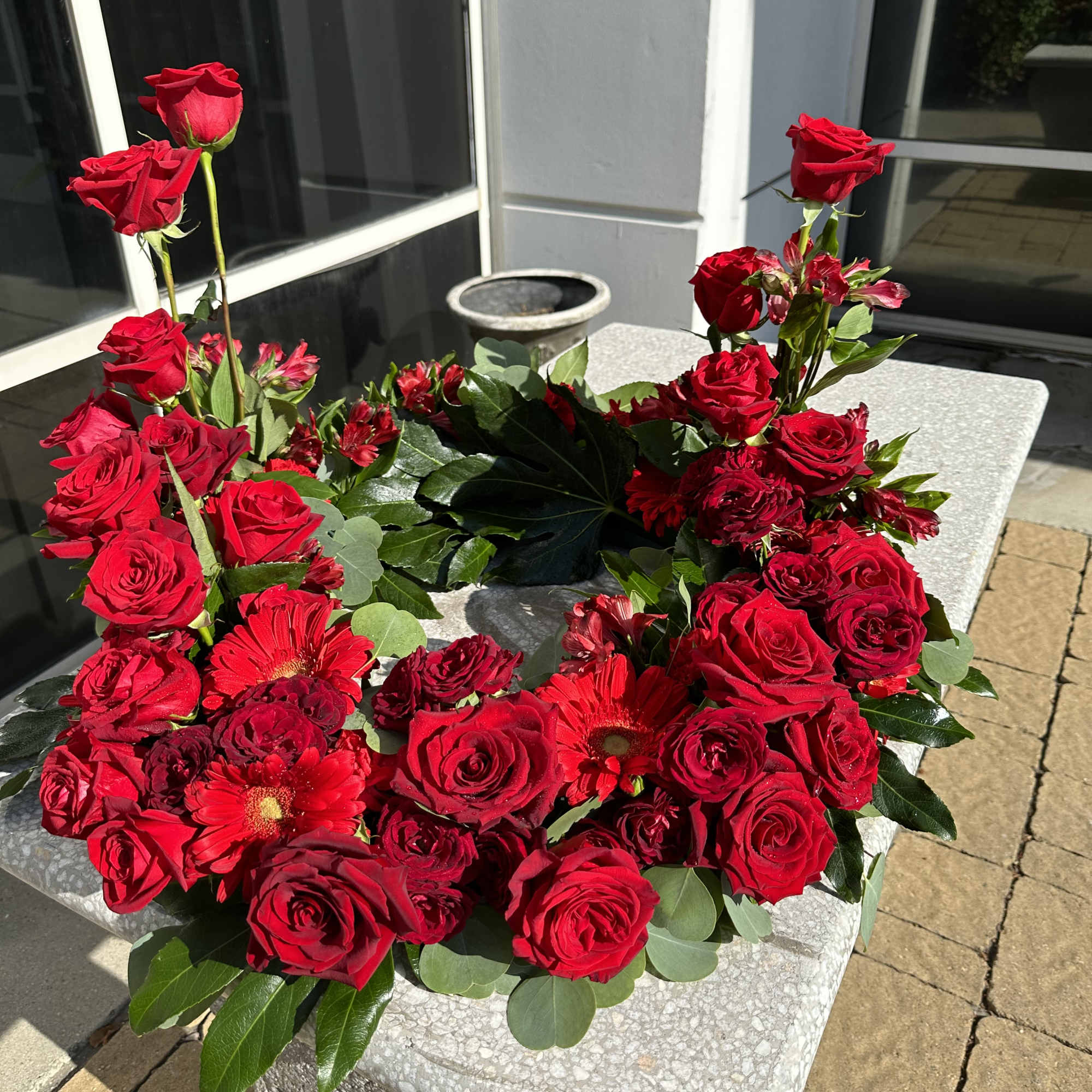 Gorgeous red flowers gerbera daisy, red roses, alstroemerias and carnations 