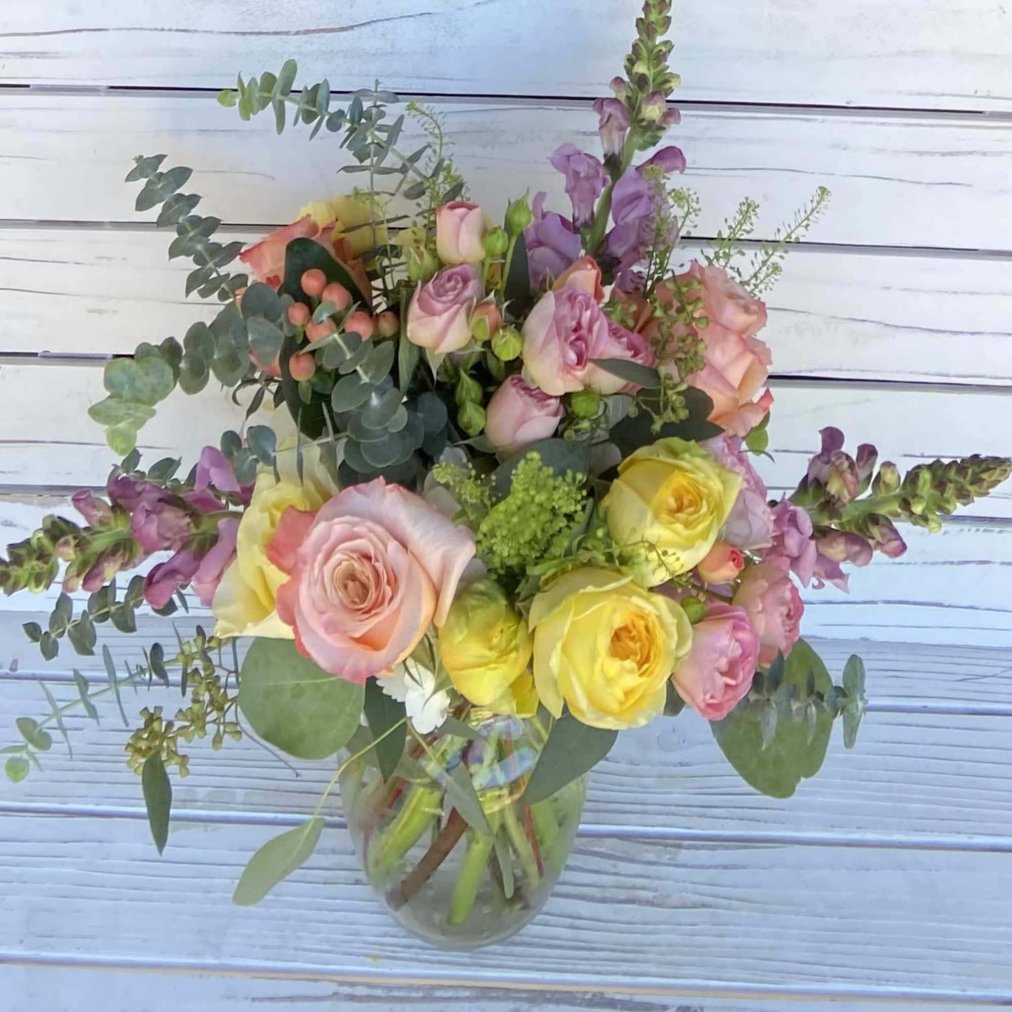 Exact flowers and vase may vary. this measures approximately 12-14 inches both