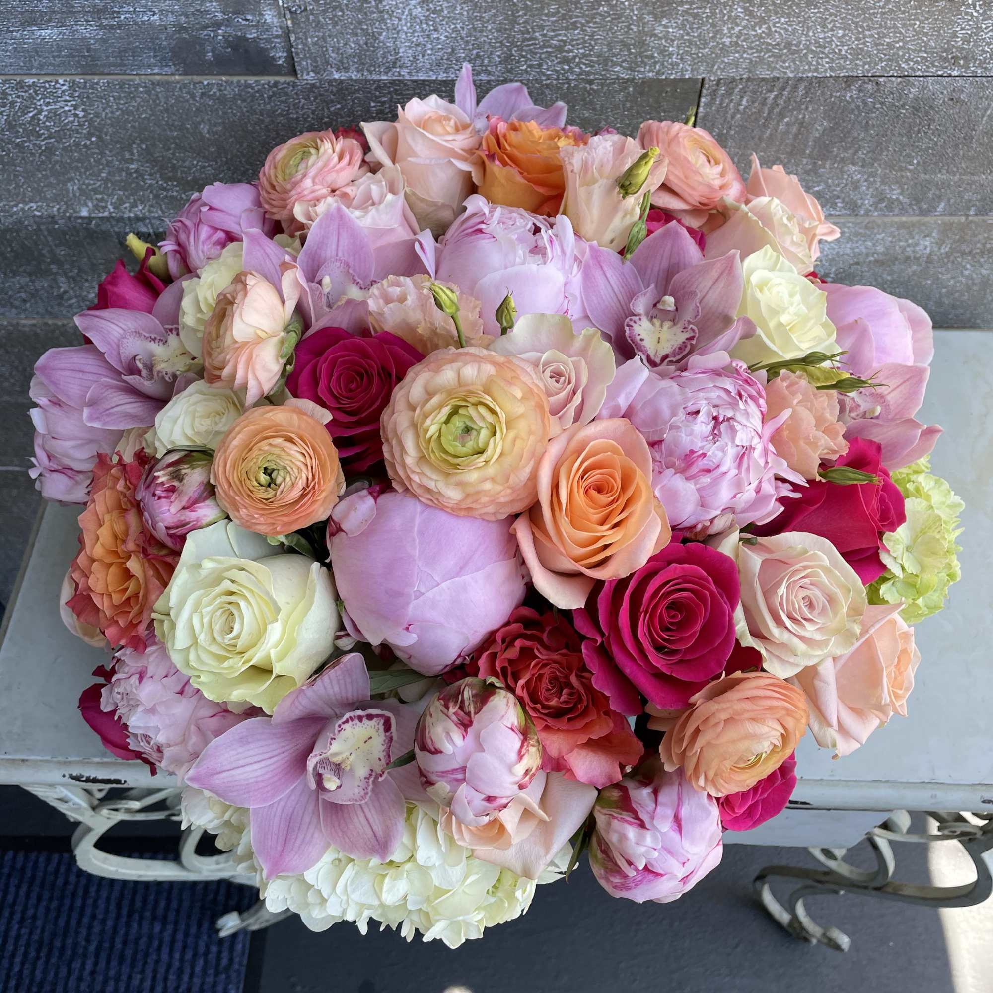 Mixed bouquet of pink, peach, and white flowers