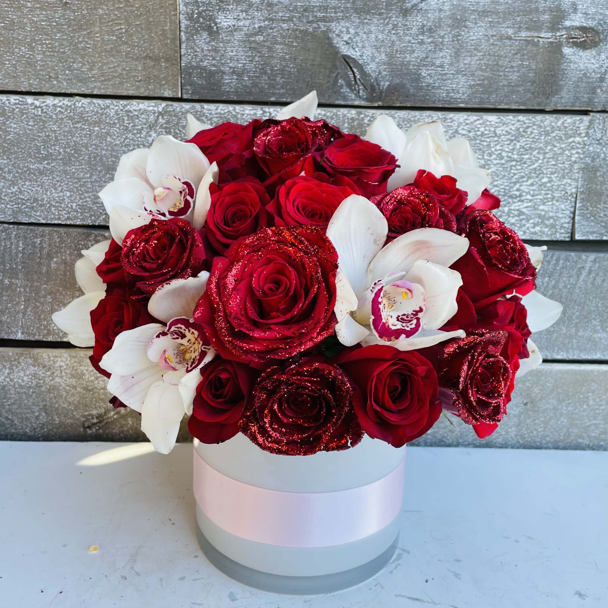 Red roses and white orchids in a round white box, photo 3 of 3