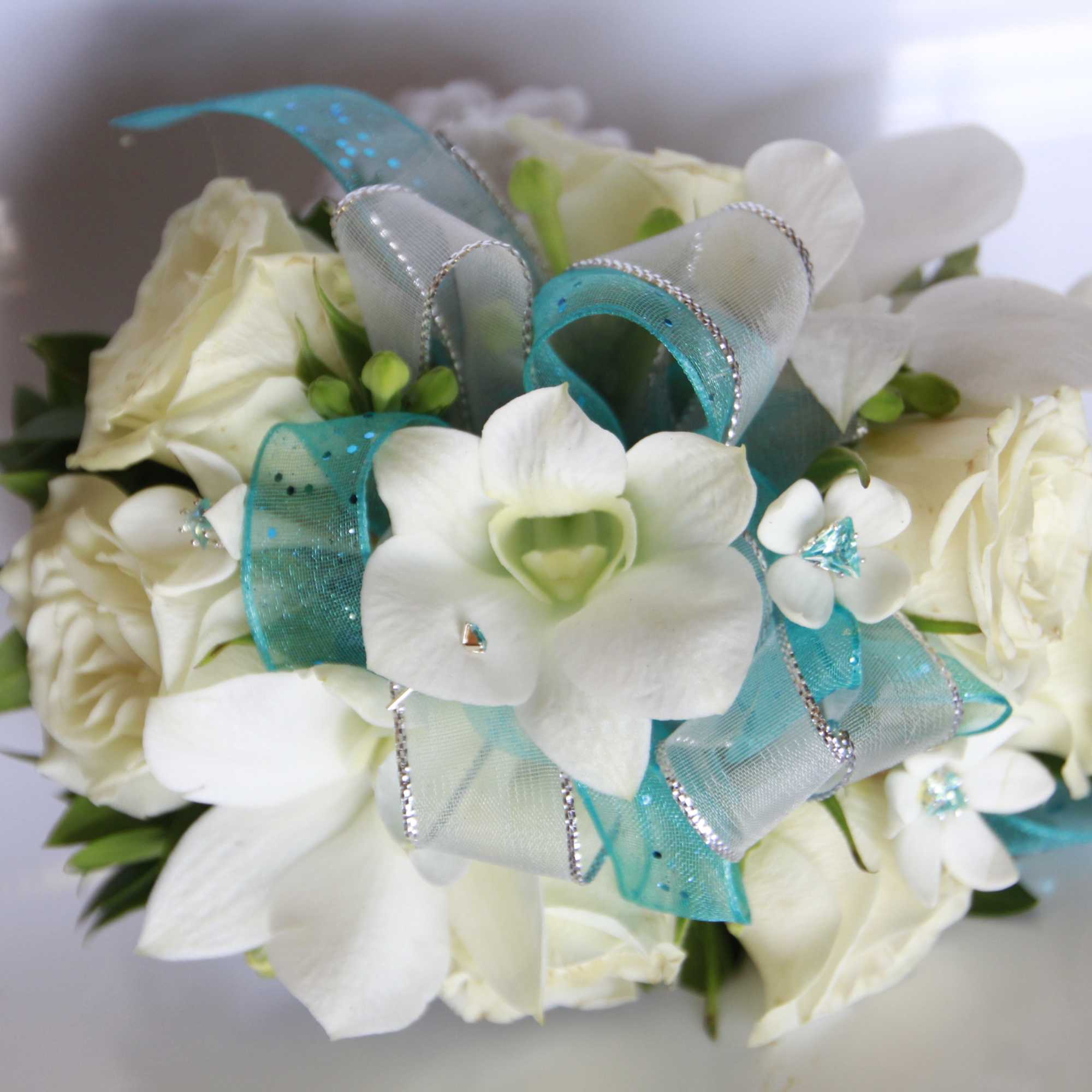 White rose and orchid bouquet with turquoise ribbon accents