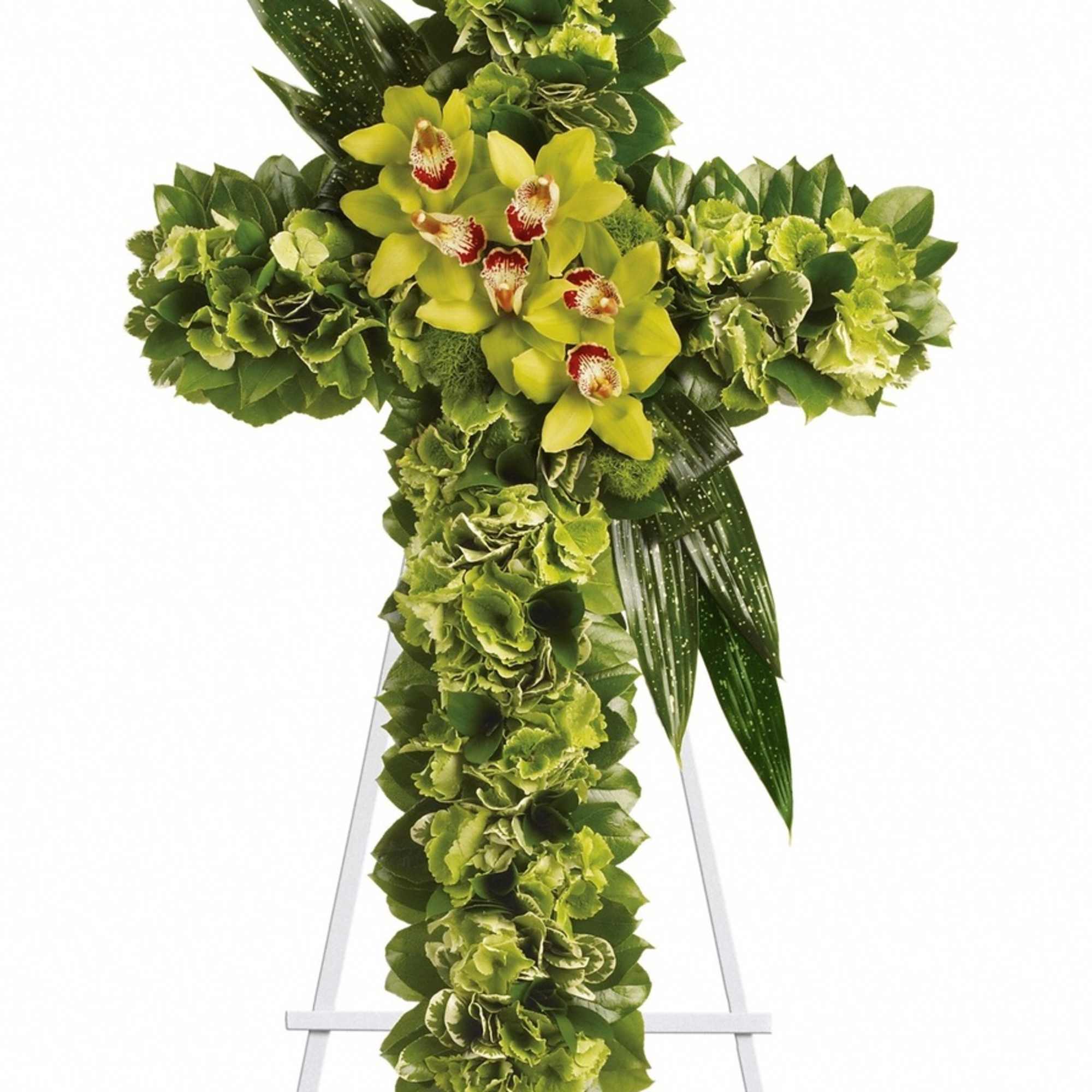 Green floral cross with yellow orchids on a stand