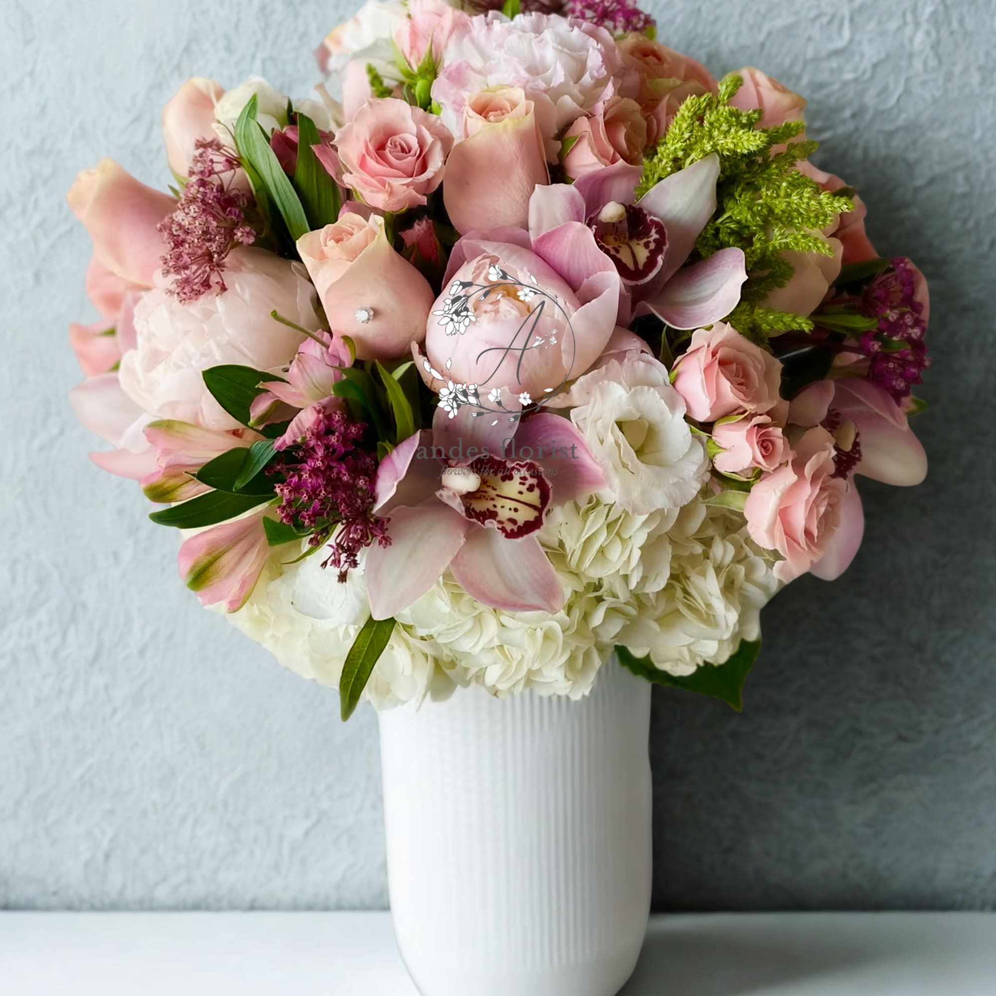 Pink and white mixed bouquet in a white vase