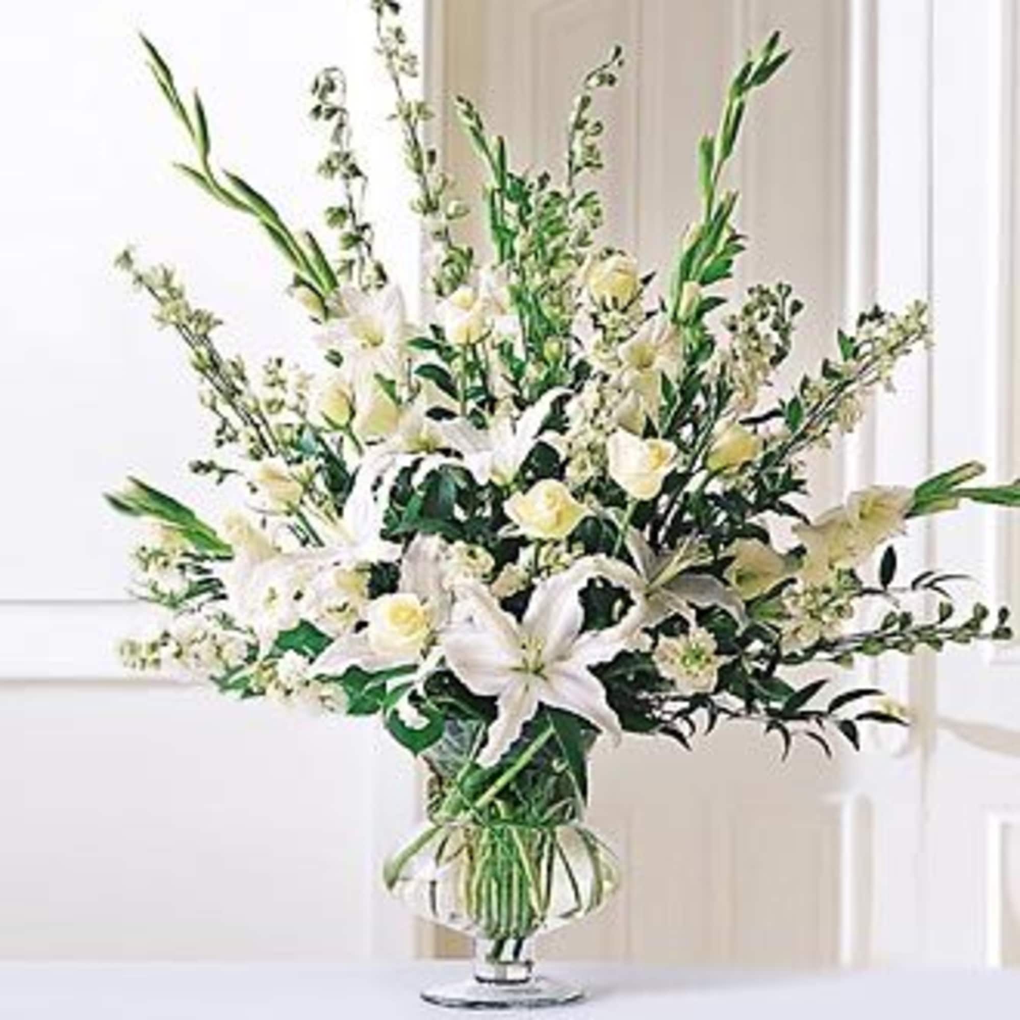 White floral arrangement in a clear glass vase