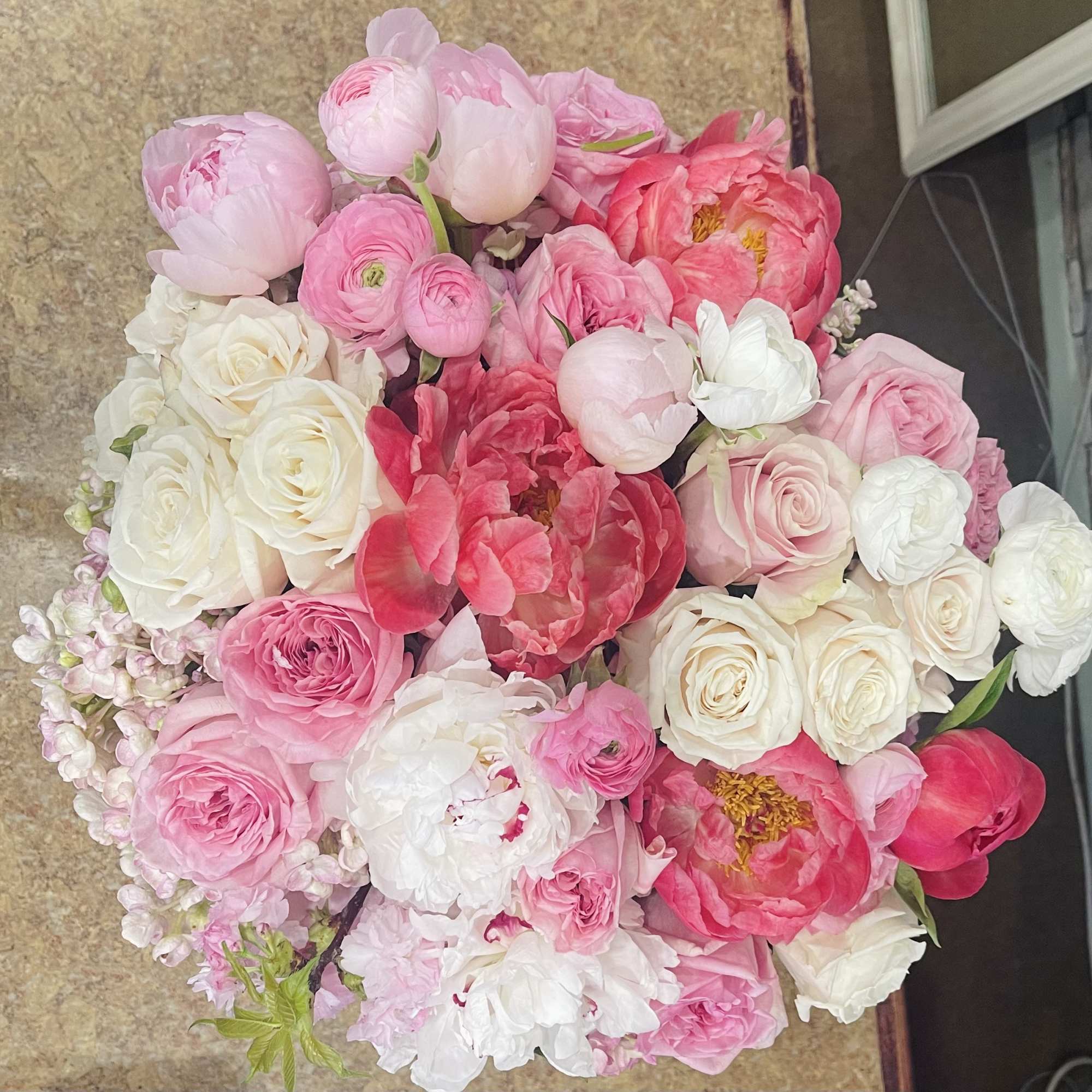 Bouquet of pink and white peonies and roses