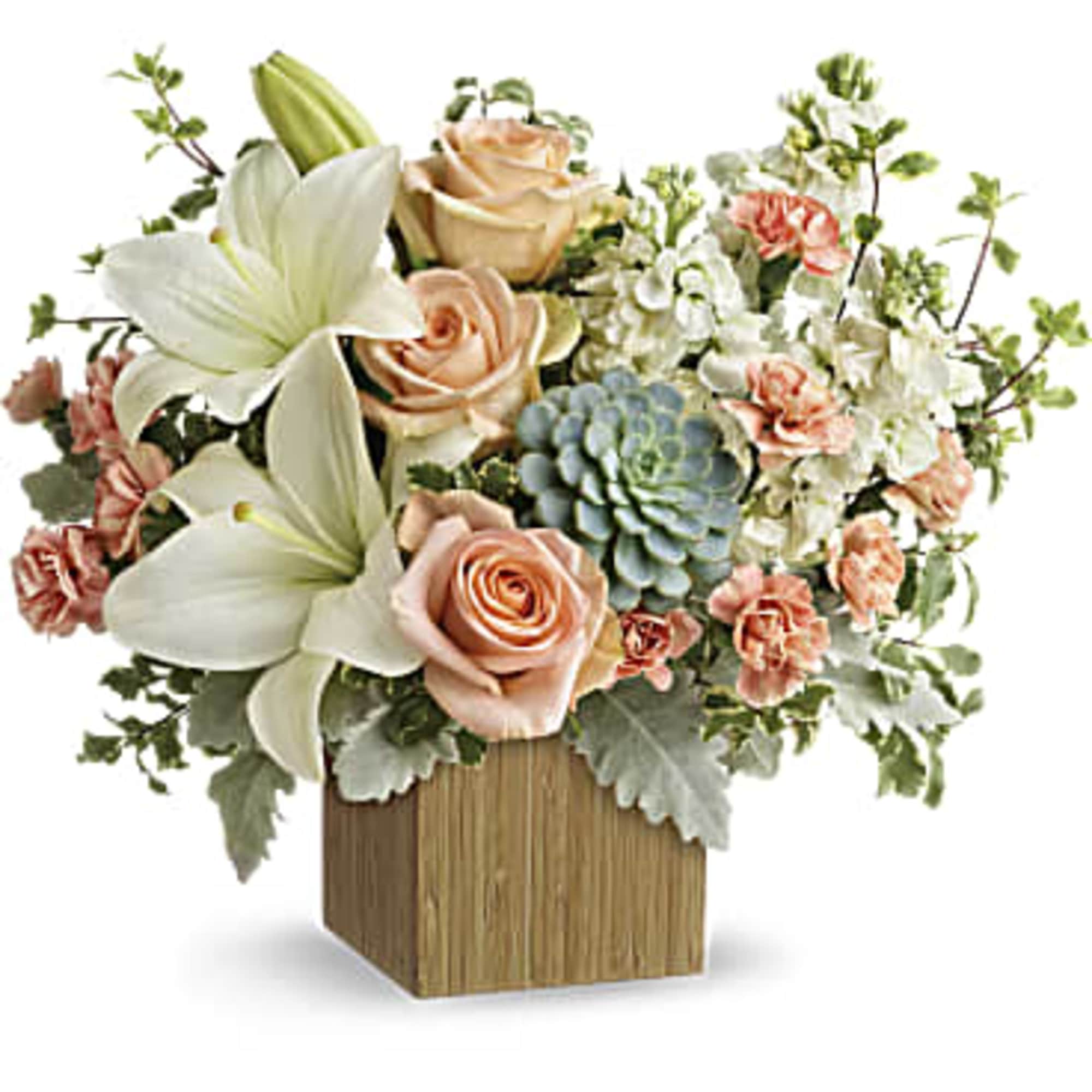 Peach roses and white lilies in a wooden box