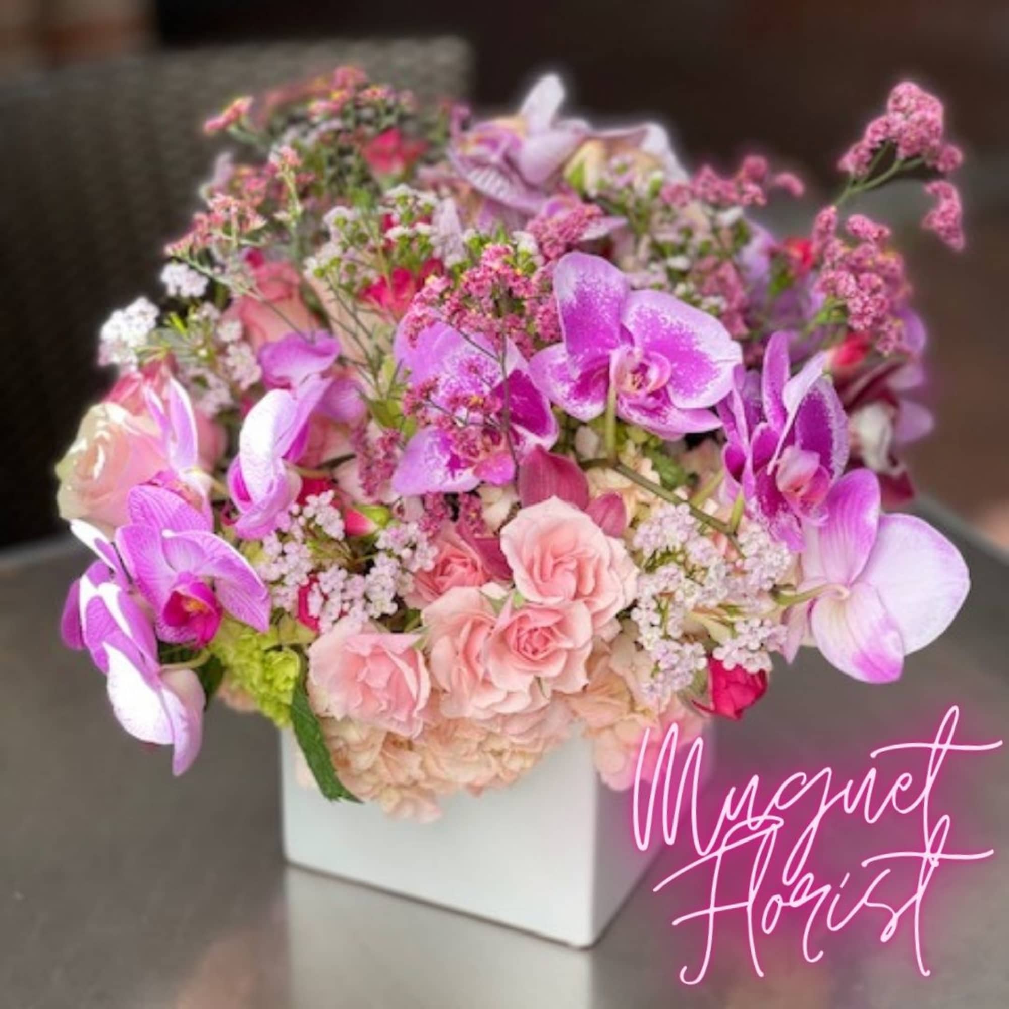 Pink and lavender floral arrangement in a white square vase, photo 5 of 14