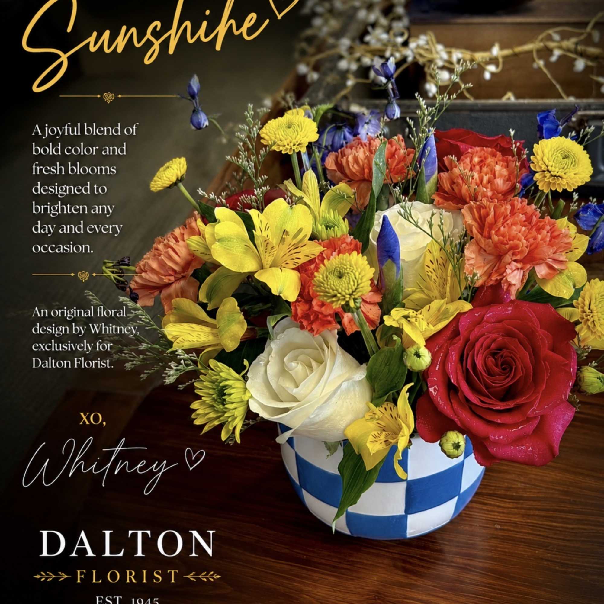 Colorful mixed flower arrangement in a blue-and-white checkered vase