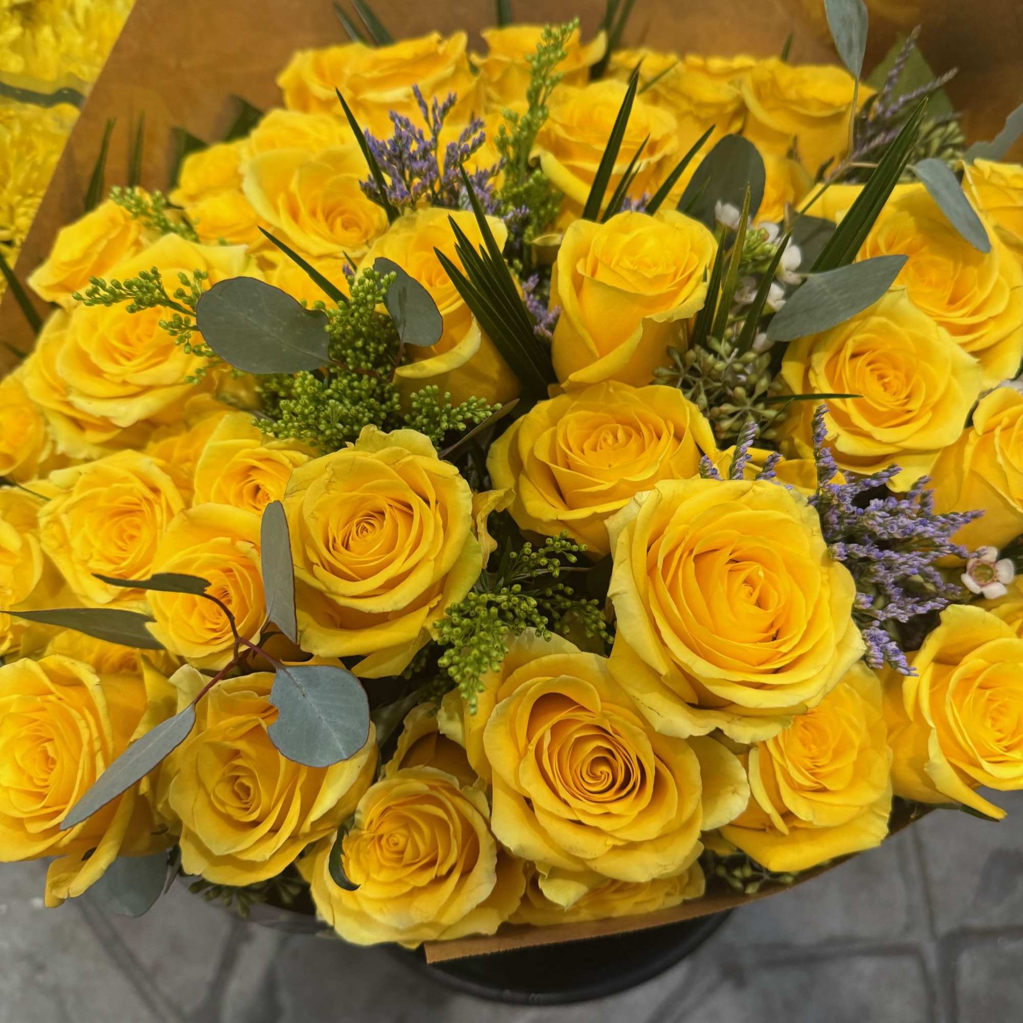 Beautiful 2 Dozen Ecuadorian red roses wrapped in brown paper.  