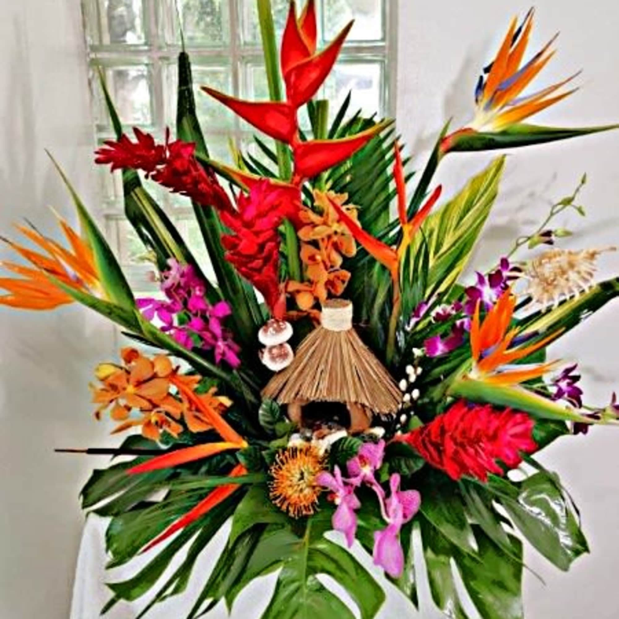 Hawaiian life comes to you with this tropical arrangement full of birds