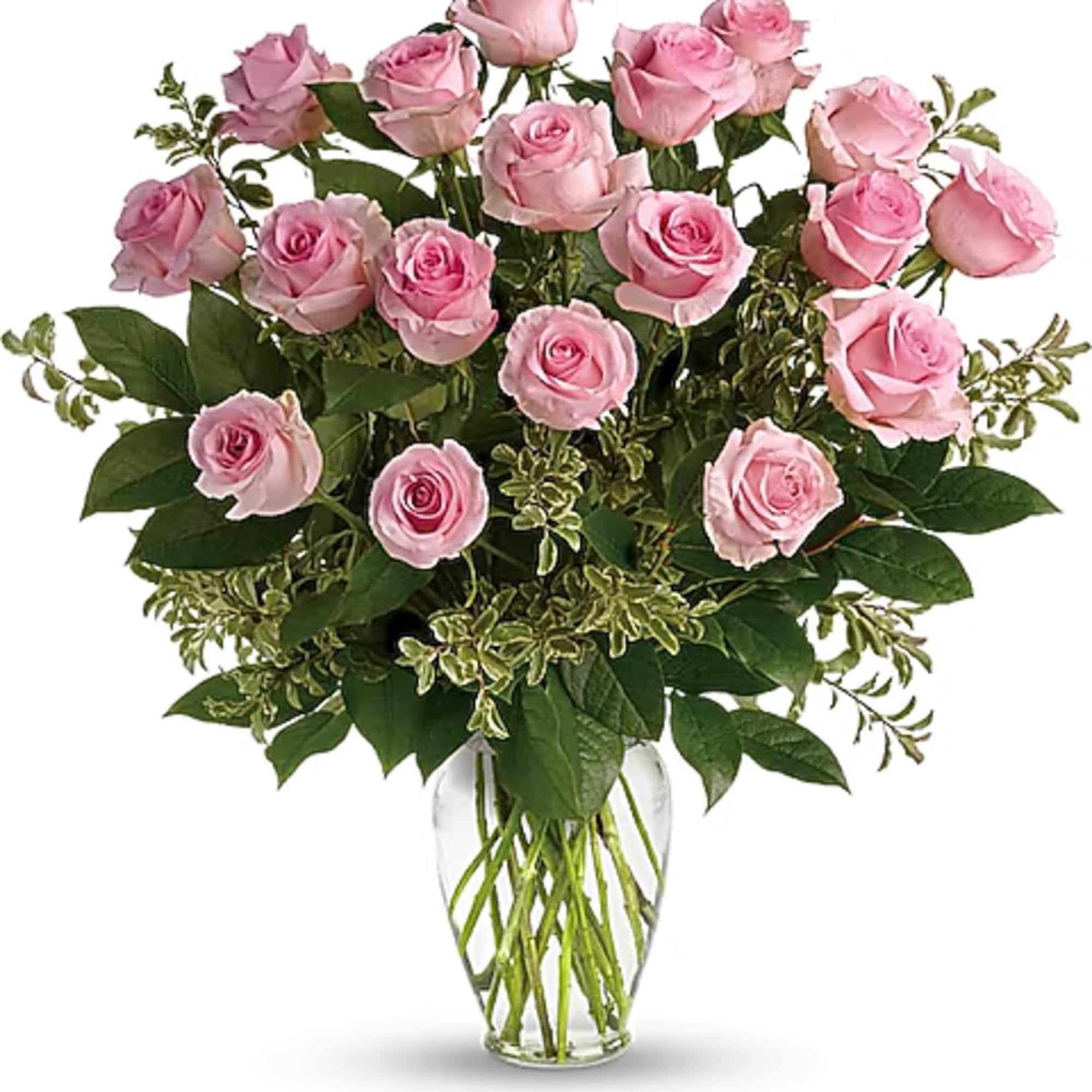 Pink roses arranged in a clear glass vase