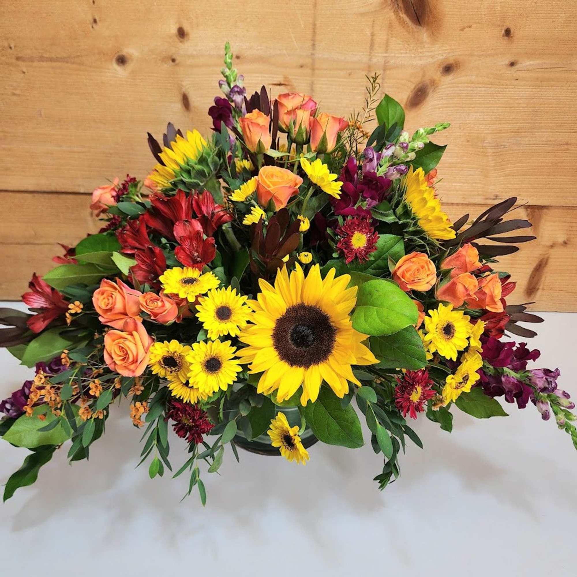 Autumn Sunshine Centerpiece

Bright and bold, this centerpiece captures the essence of fall&rsquo;s