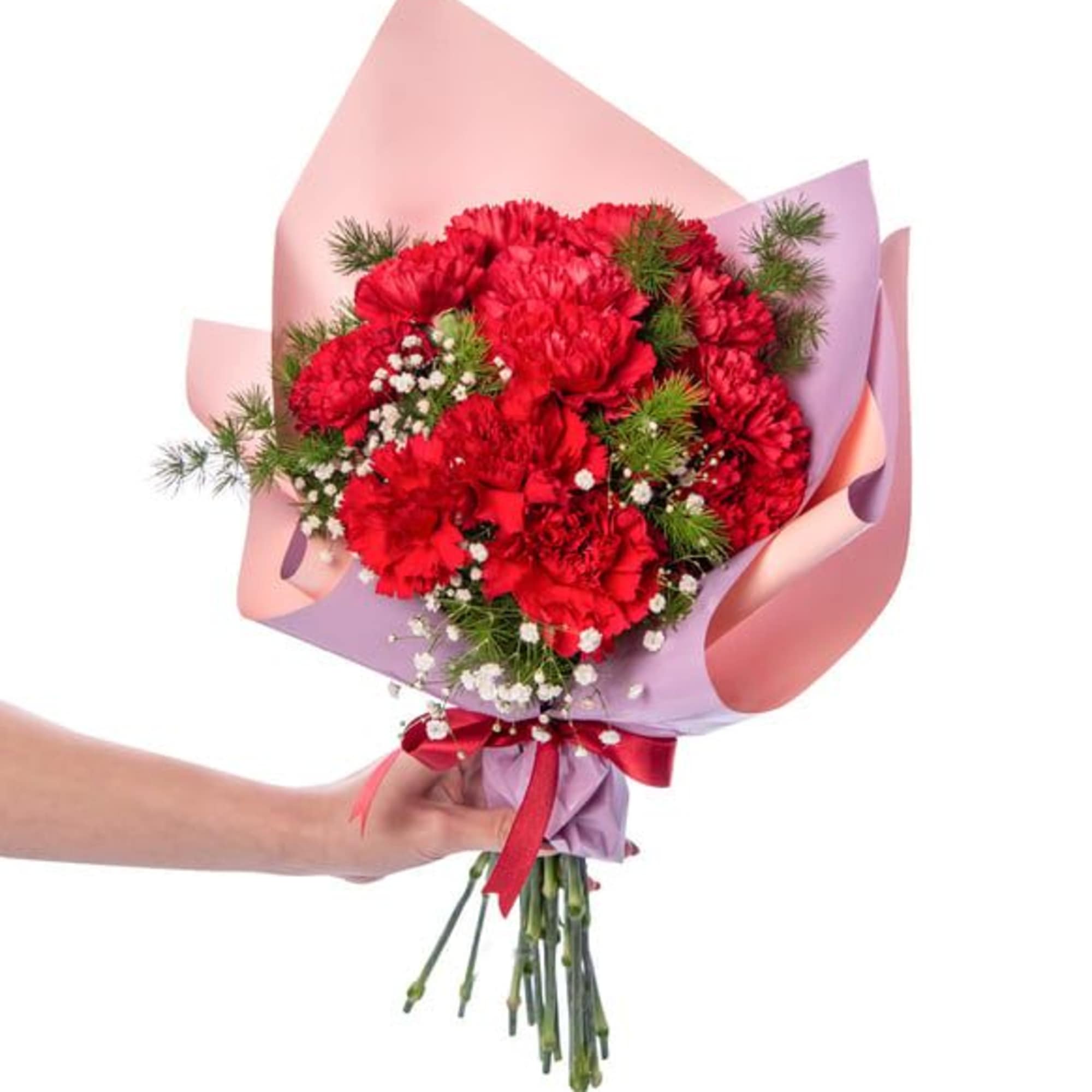 Handheld bouquet of red carnations wrapped in pink and lavender paper