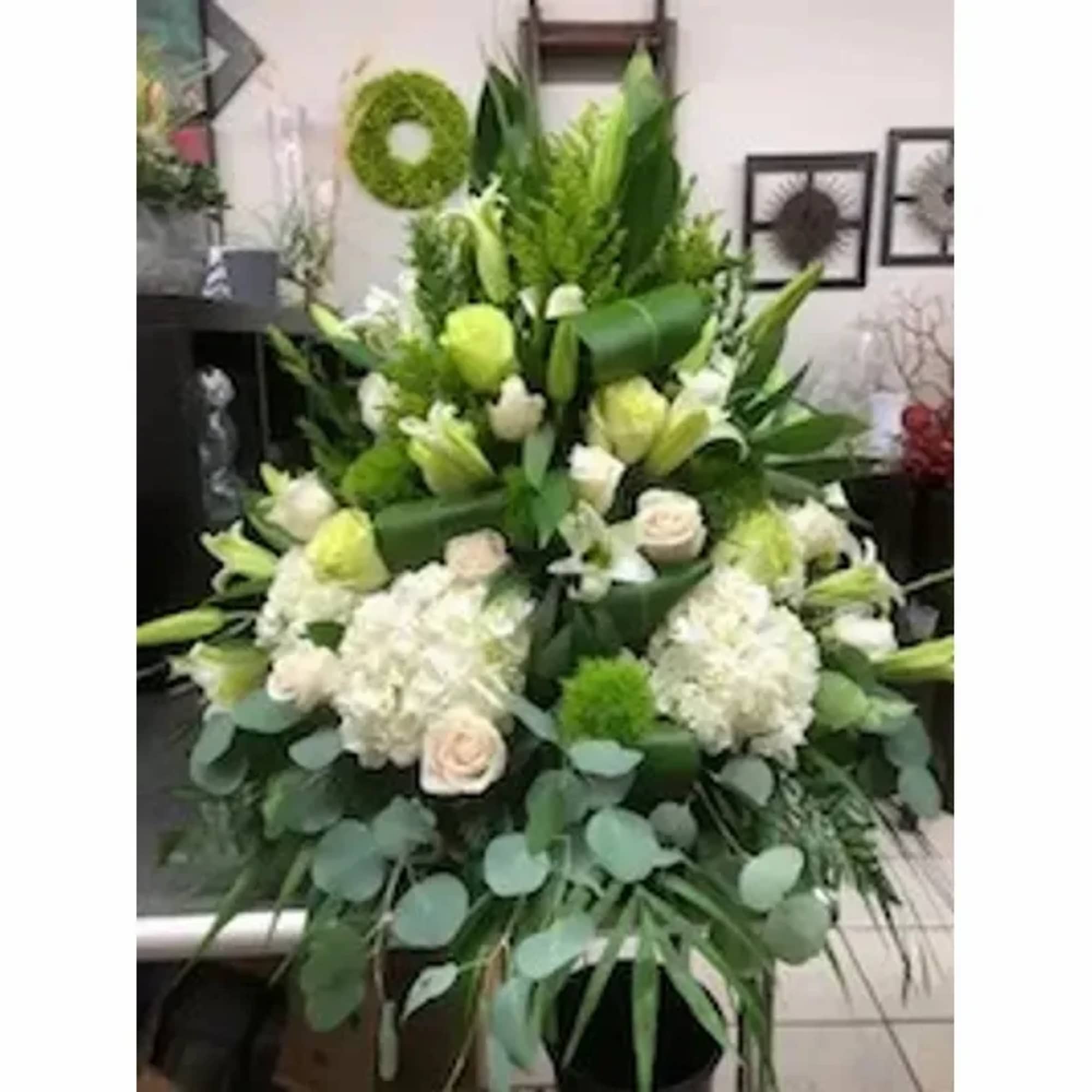 White And Green Flowers Arranged In A Basket.
