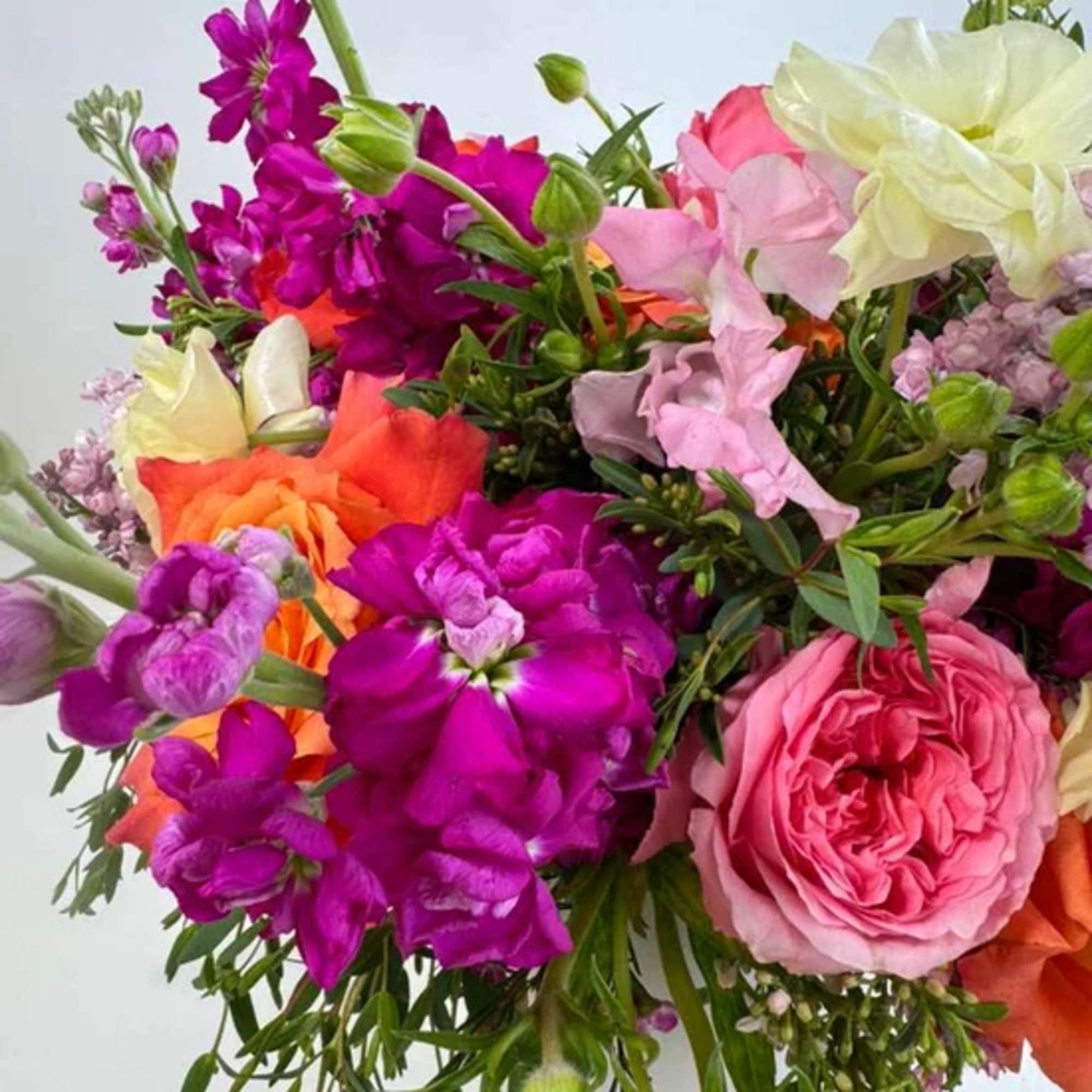 Bouquet of pink, purple, orange, and white flowers