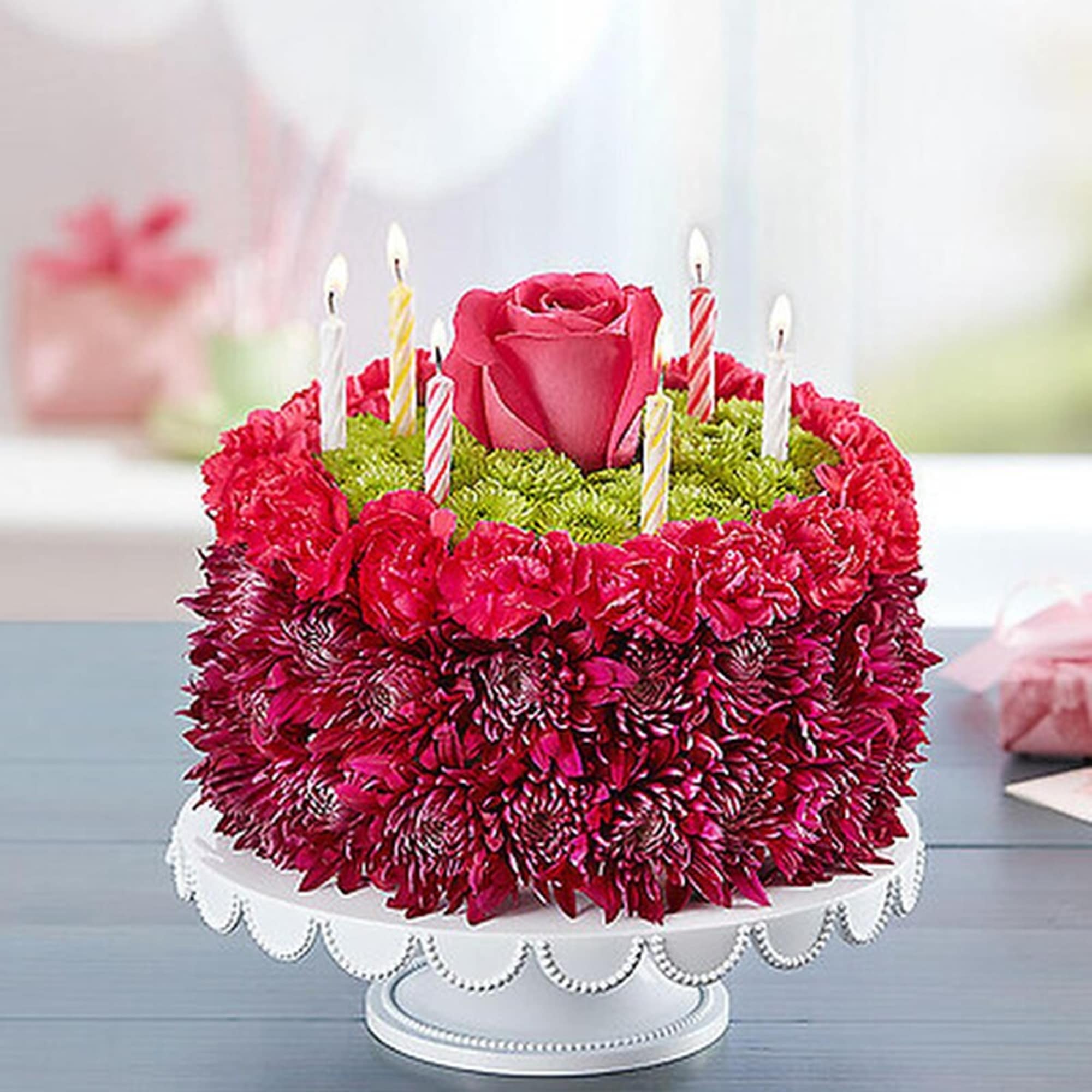 Purple adds a happy pop with this Birthday Wishes Flower Cake. Handcrafted