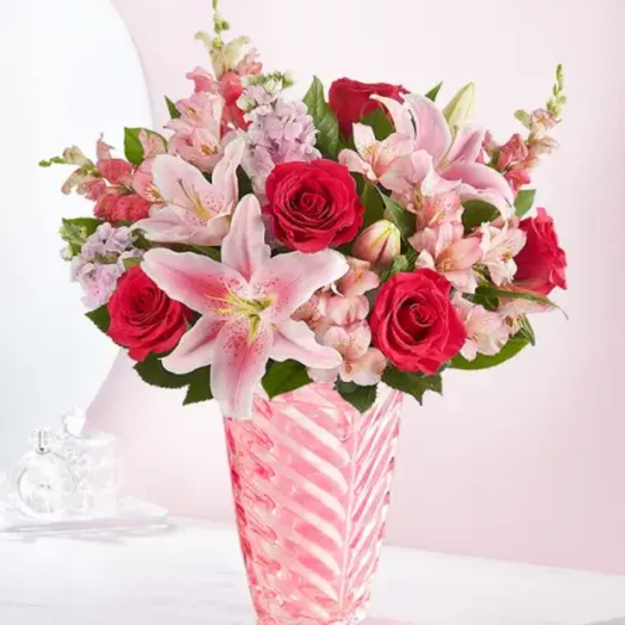Simply pink. Simply spectacular! Our lovely arrangement is designed in a keepsake