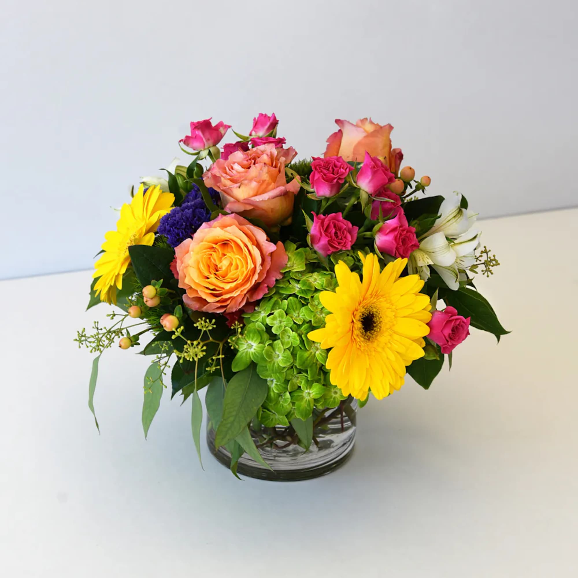 Give someone a surprise with this charming vase of flowers overflowing with