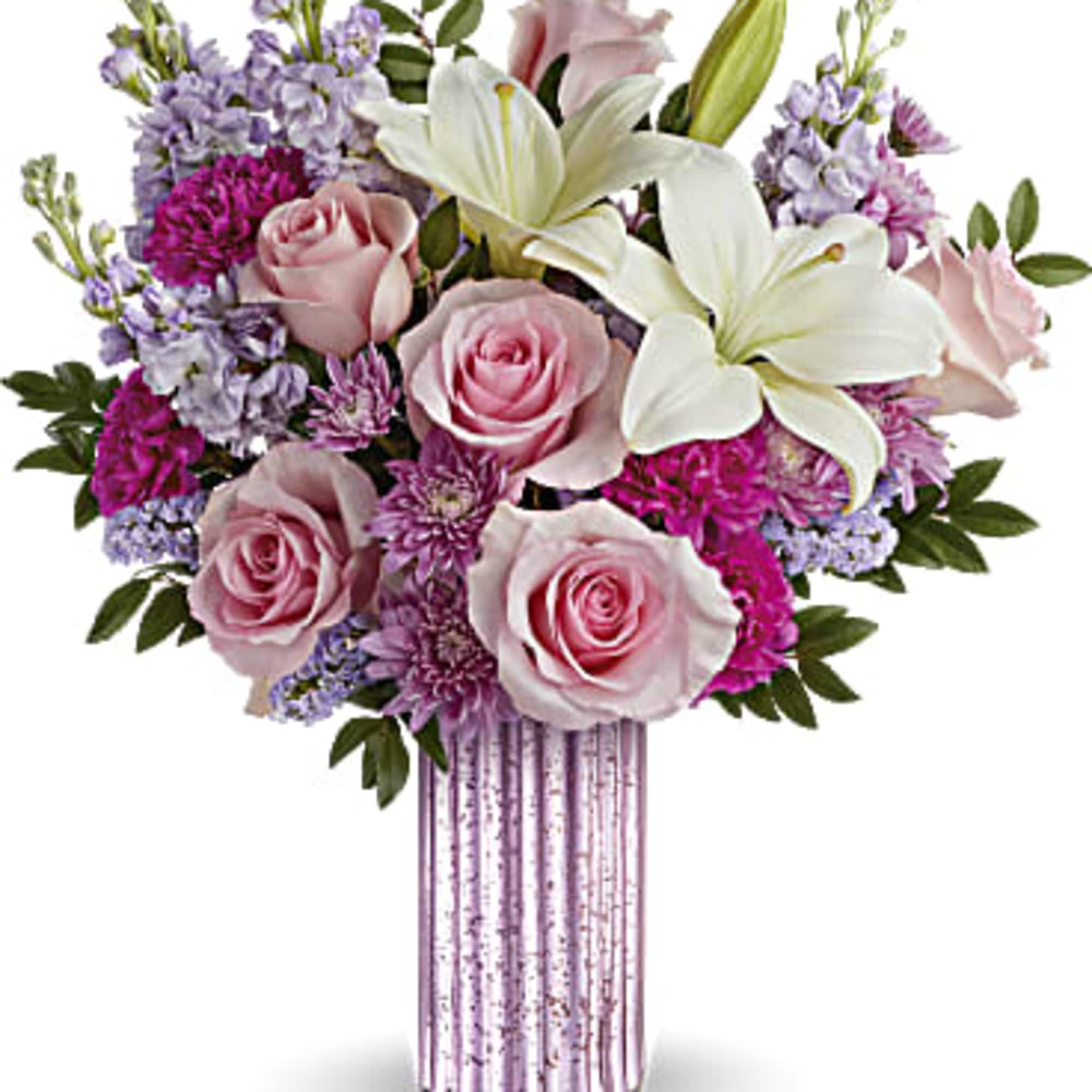 Pink roses and white lilies arranged in a striped vase