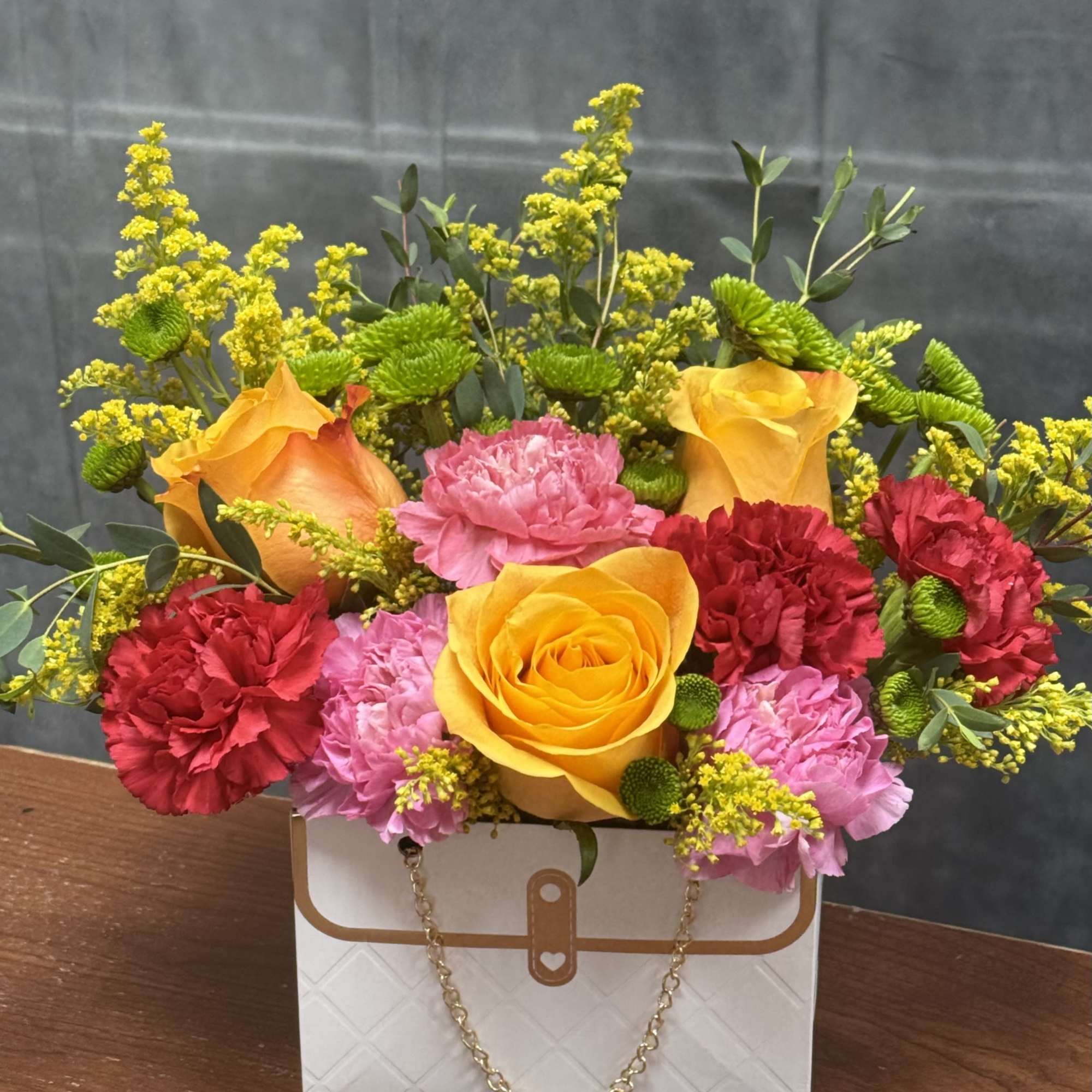 Step into a world of vibrant delight with our cheerful flower arrangement