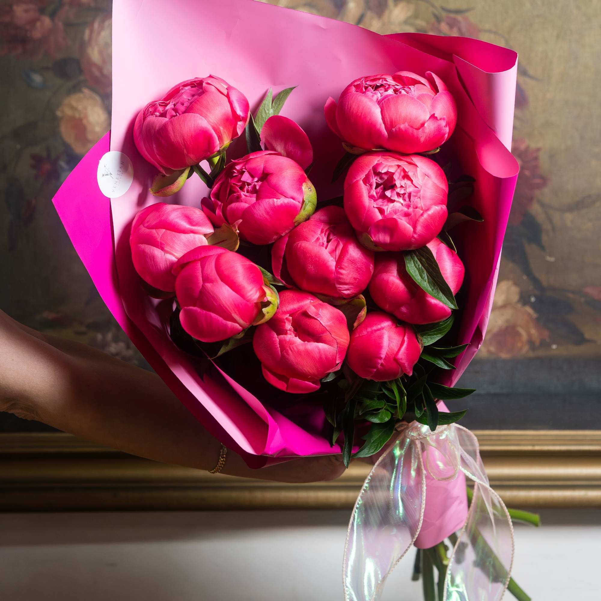 A lush cluster of vivid pink peonies makes a joyful, romantic statement-perfect