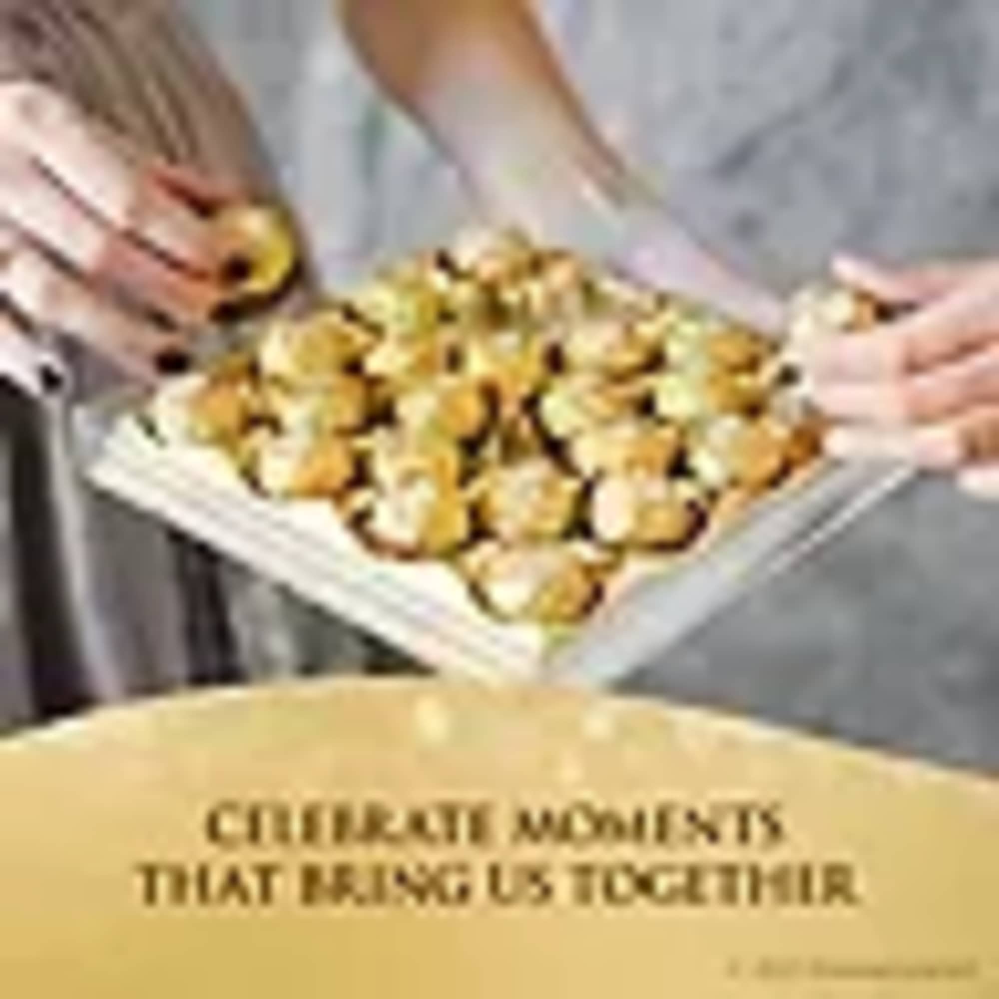Tray of small golden pastries being held by several hands